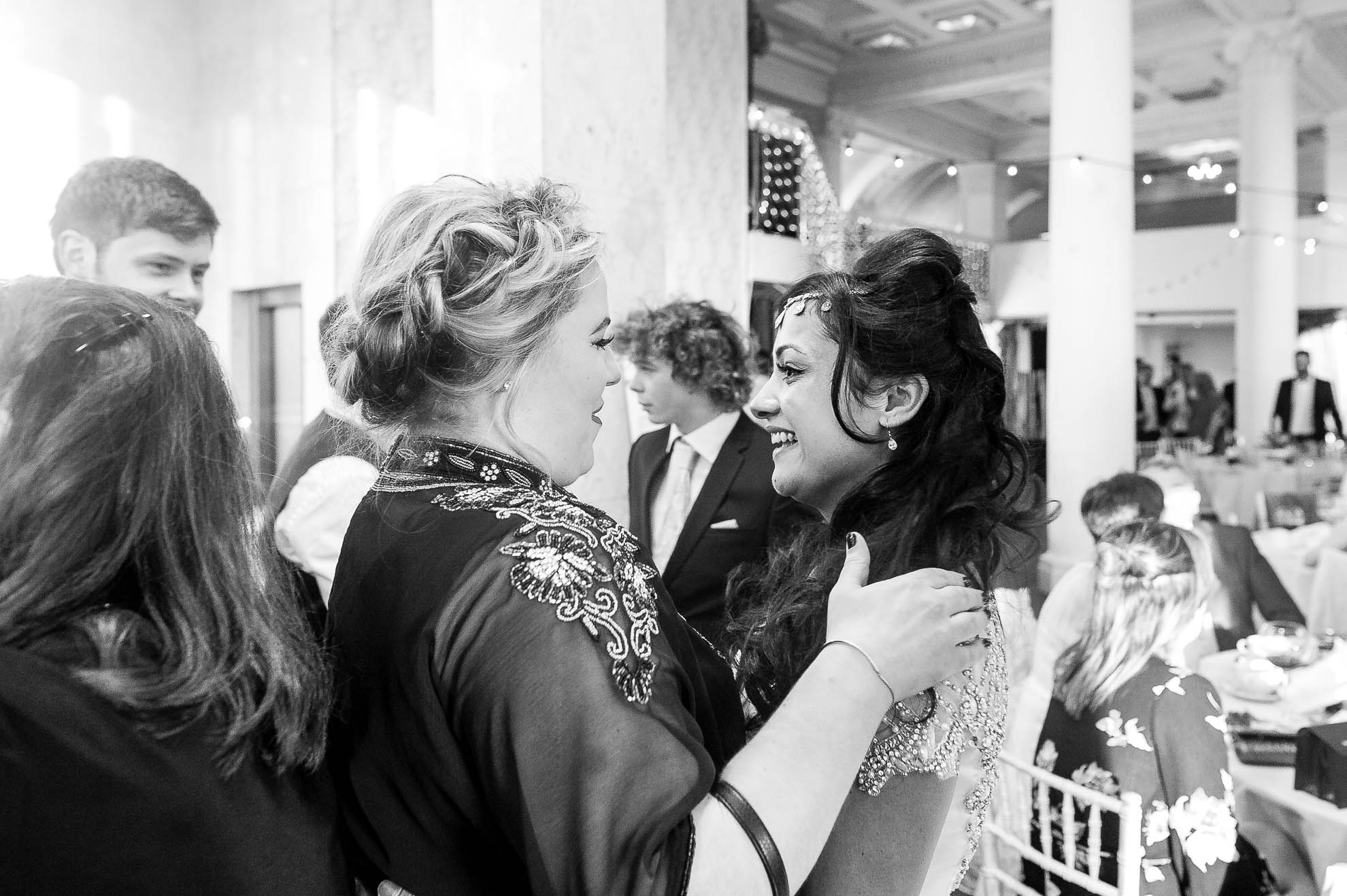 a guest give the bride a hug