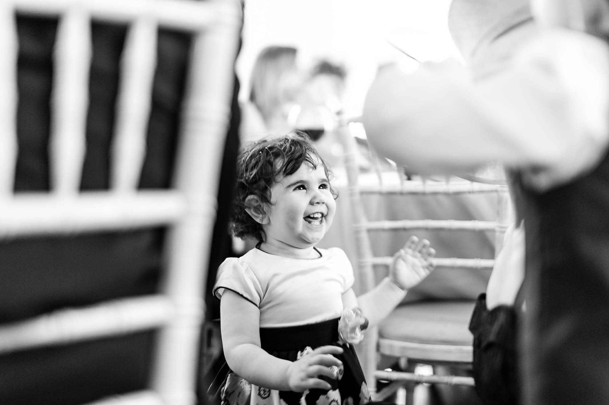 Little girl laughs at her brother