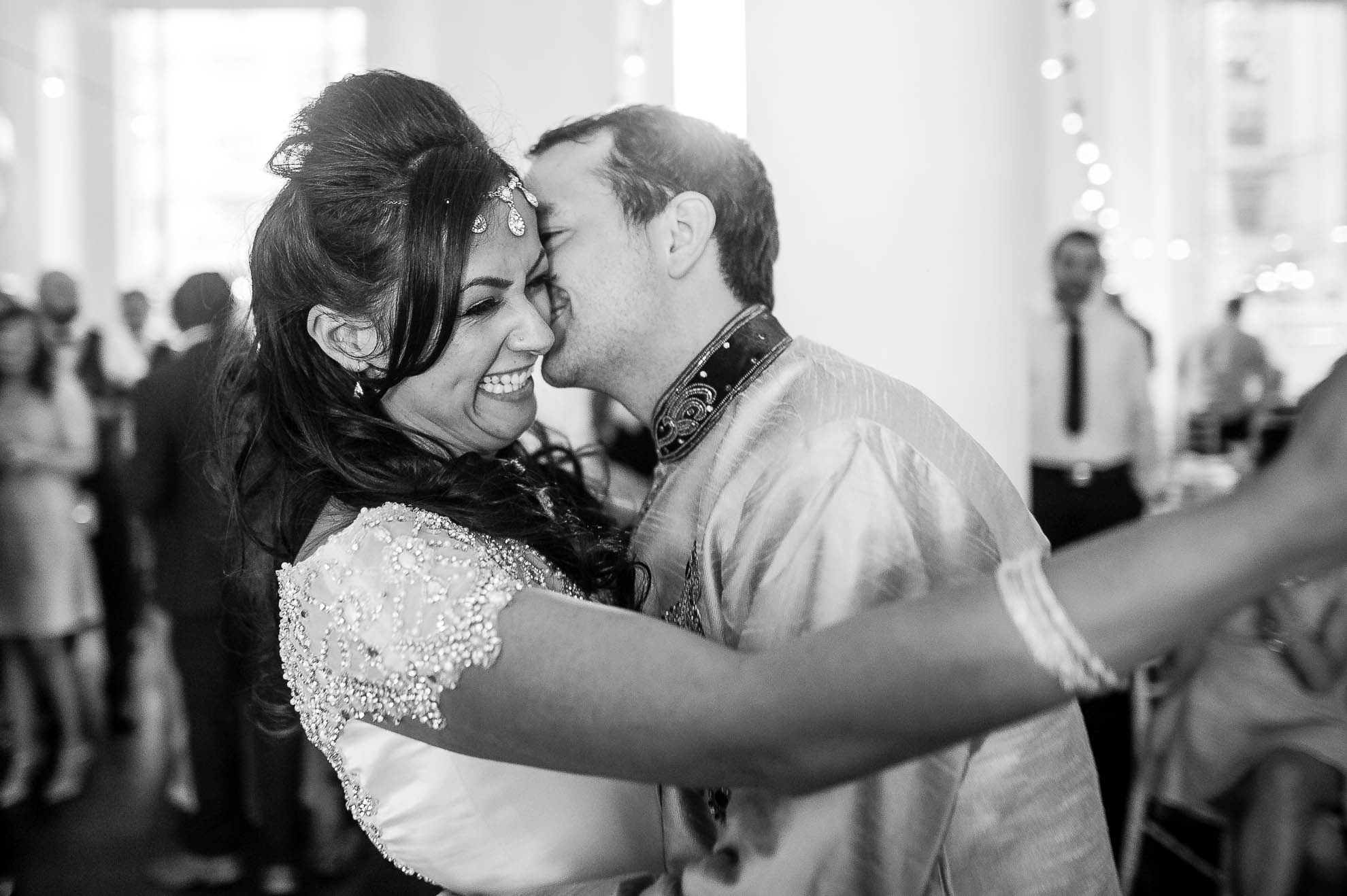 Bride laughing during the first dance