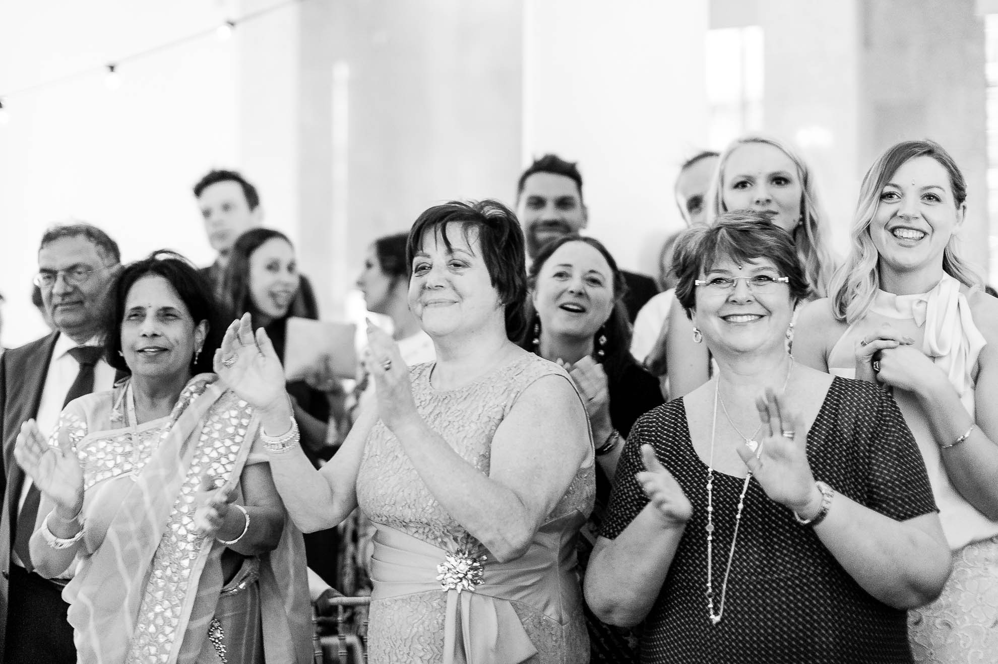 Mother of the bride looks on during the first dance
