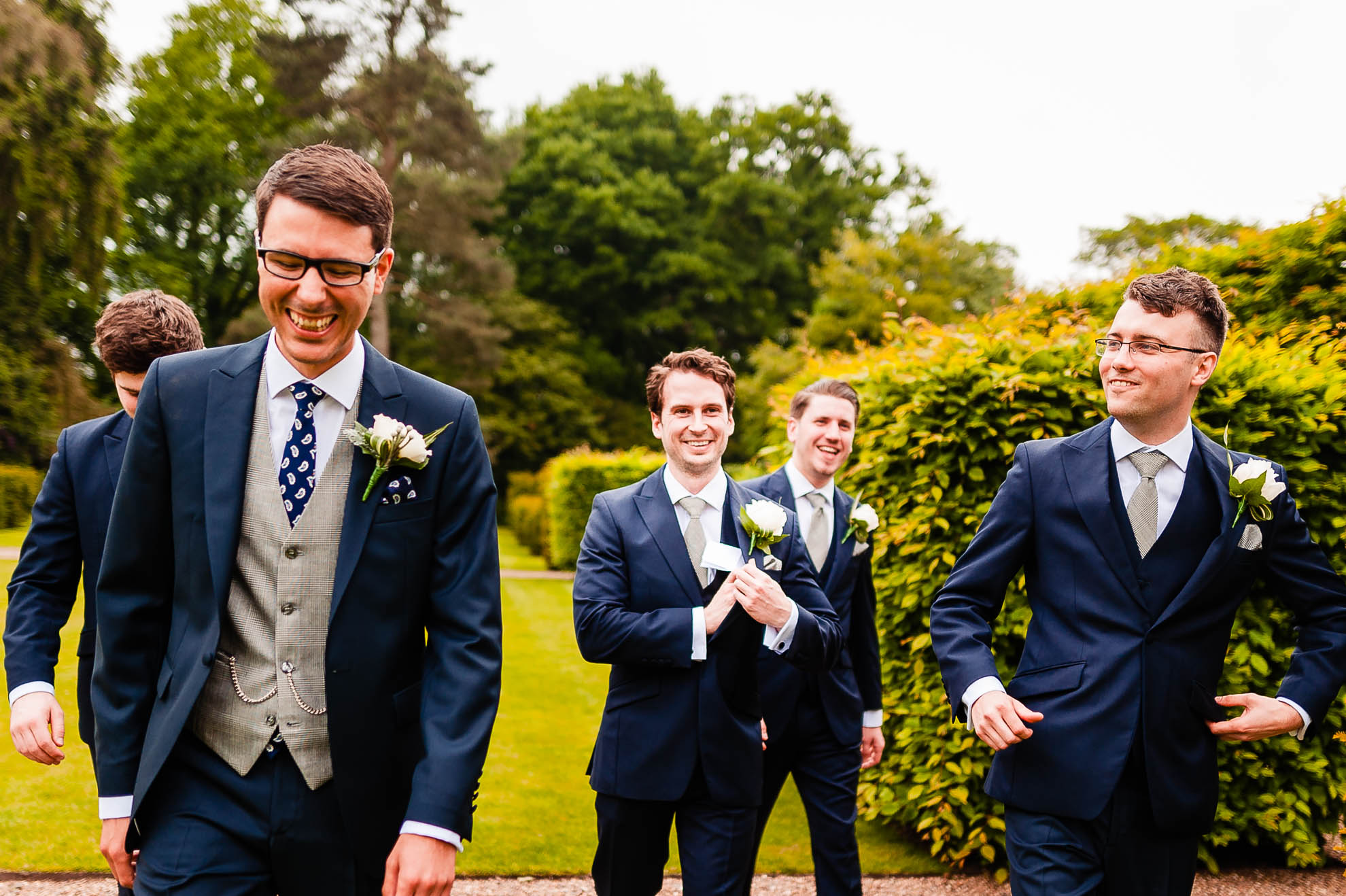 groom and his groomsmen share a joke