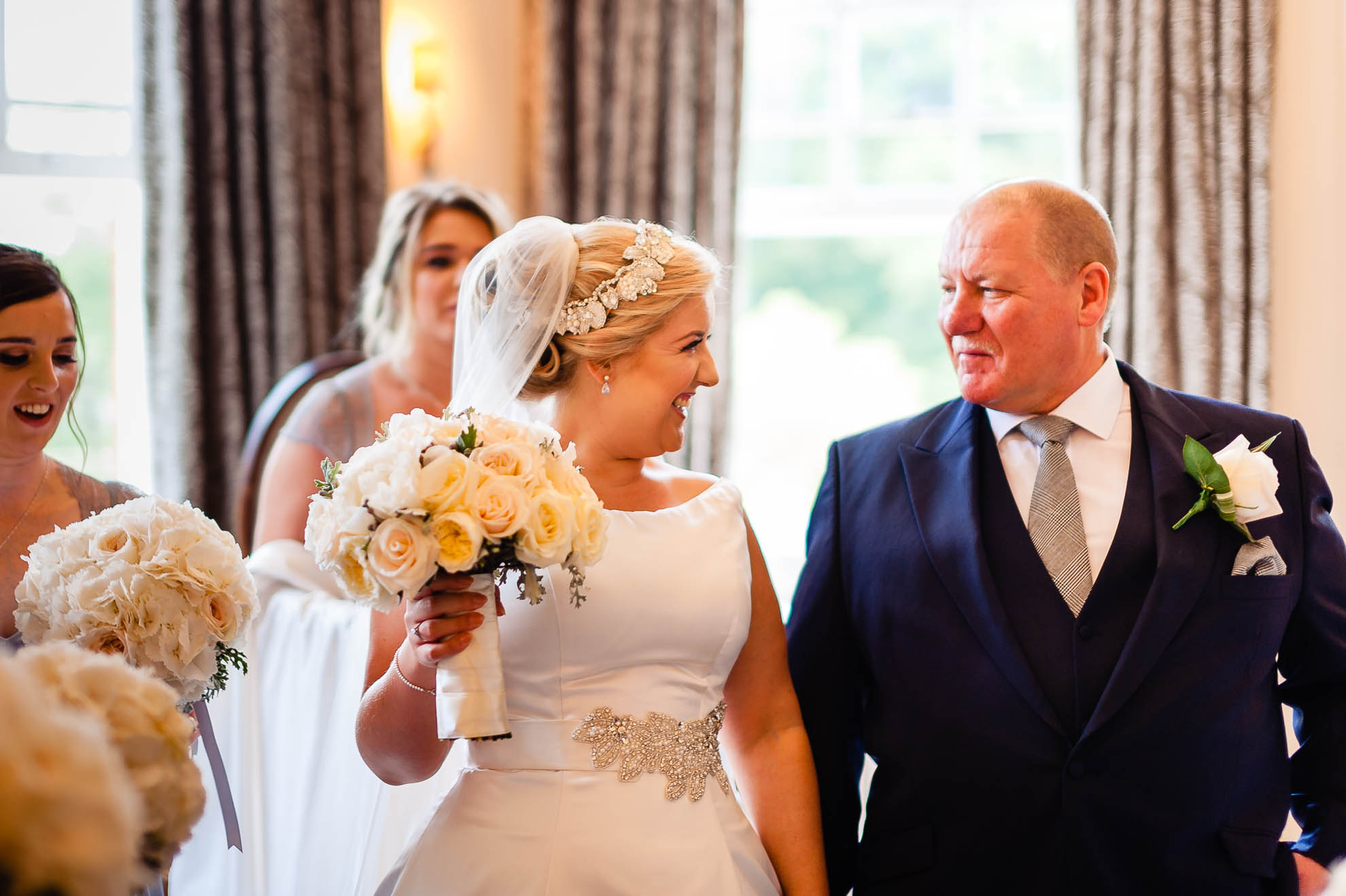 bride laughs with her father