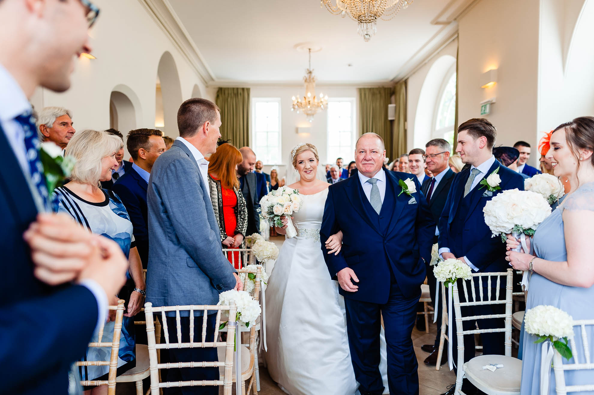 Bride walks up aisle wit her father