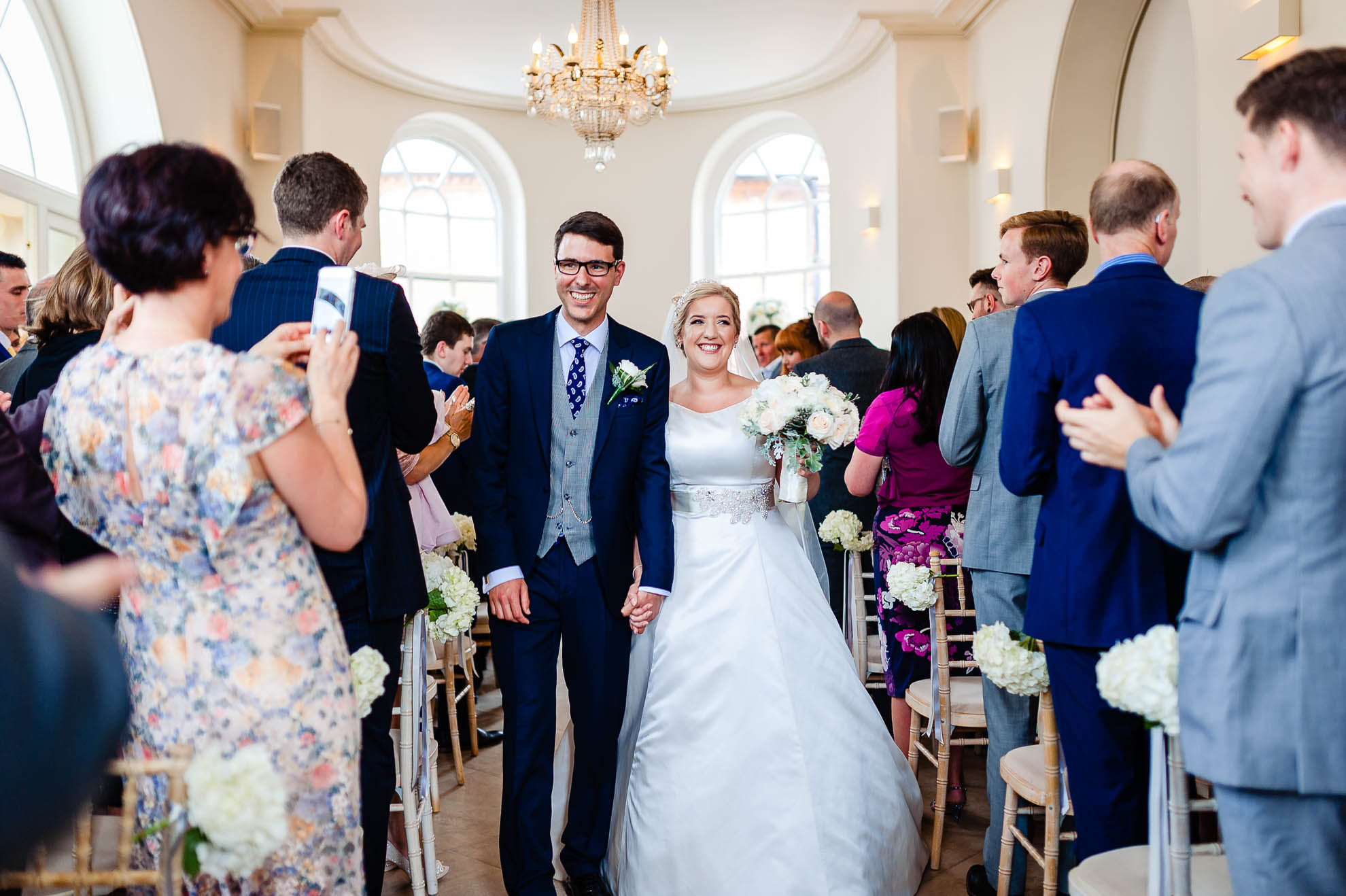 Bride and groom walk back down the aisle