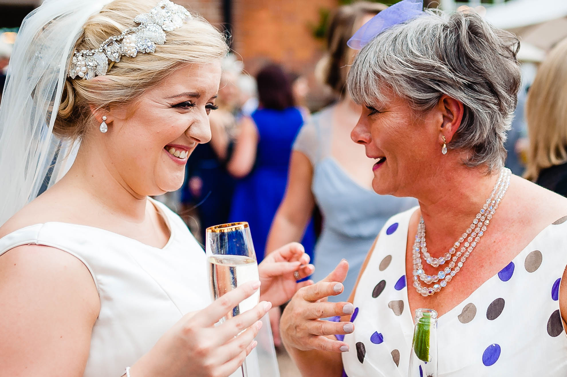 Bride share a joke with guest