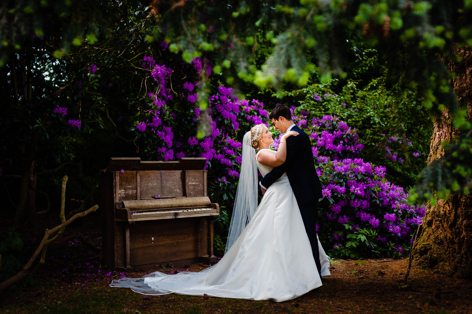 Bride and groom portrait by flowers