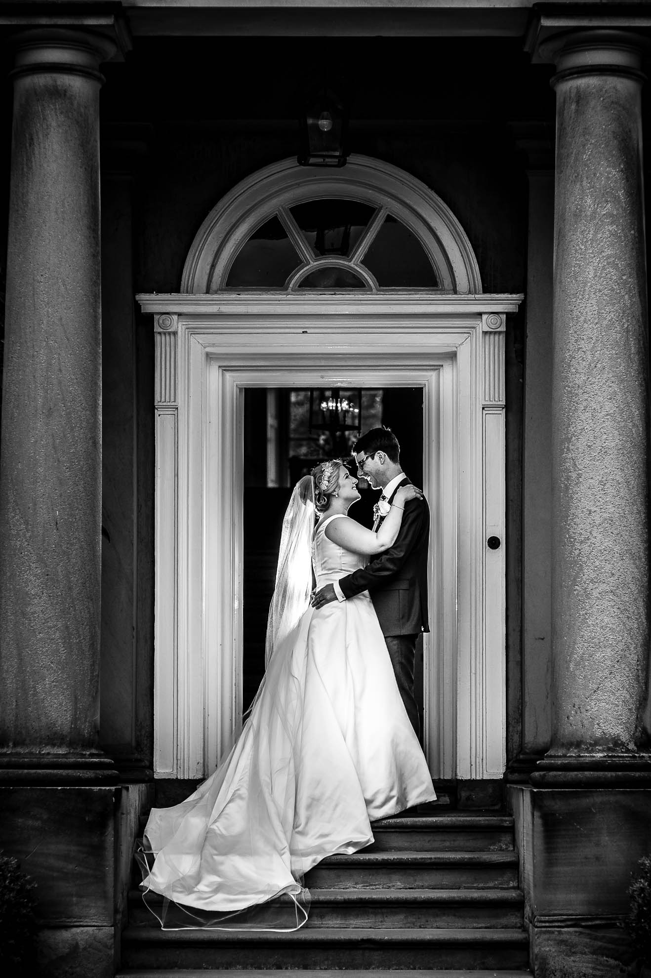 Bride and groom portrait on the front staircase of Iscoyd Park