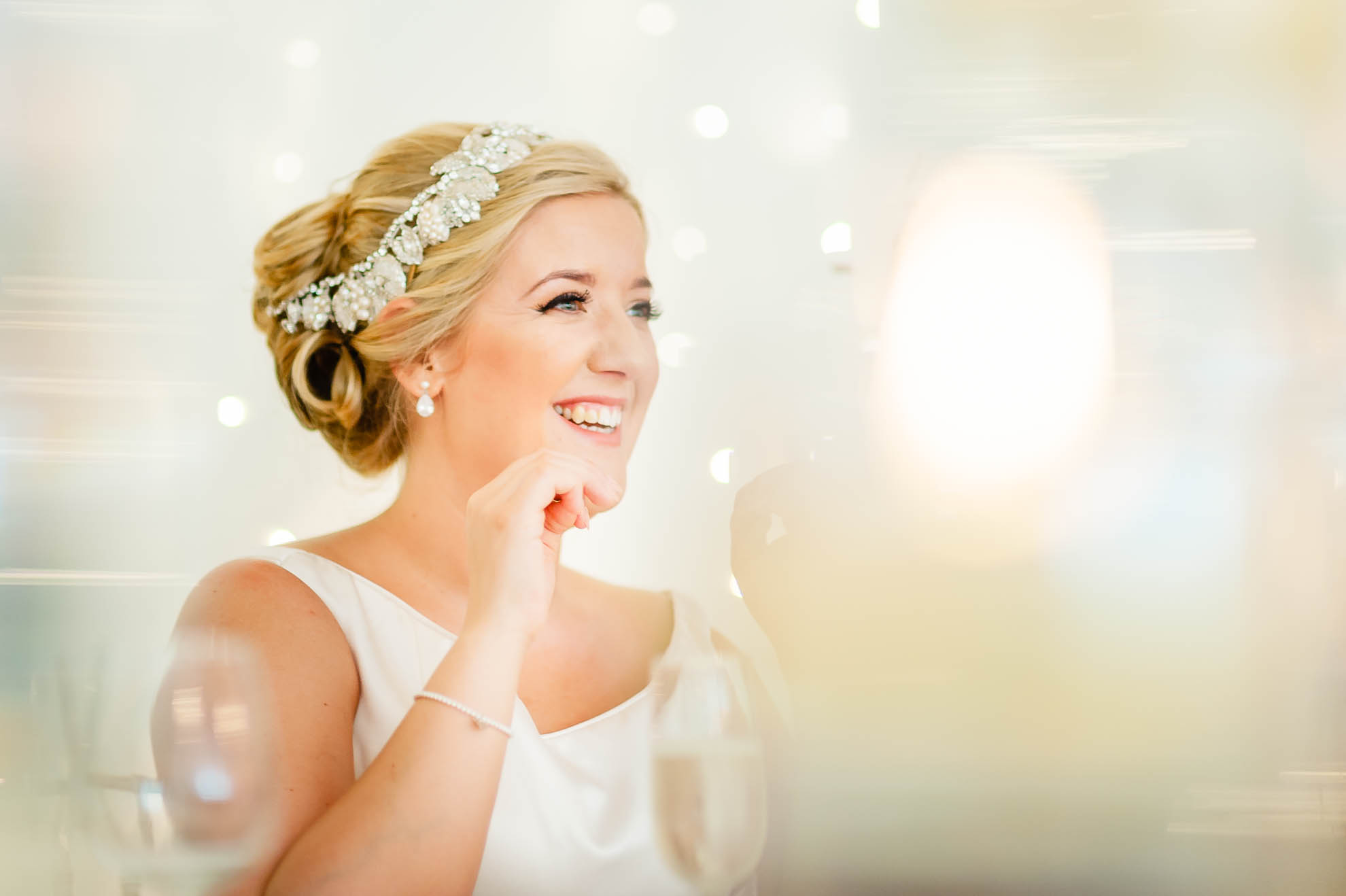 Bride laughs at grooms speech