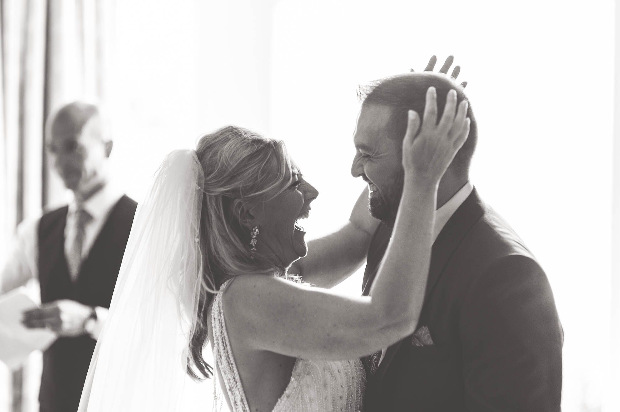 Bride and groom hug each other