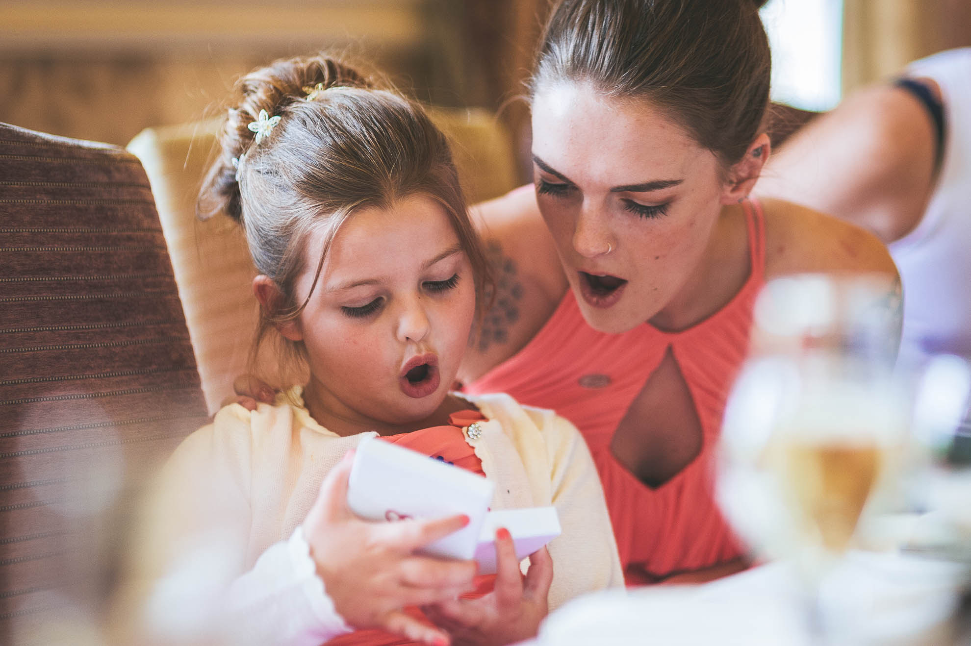 Flower girl opens present