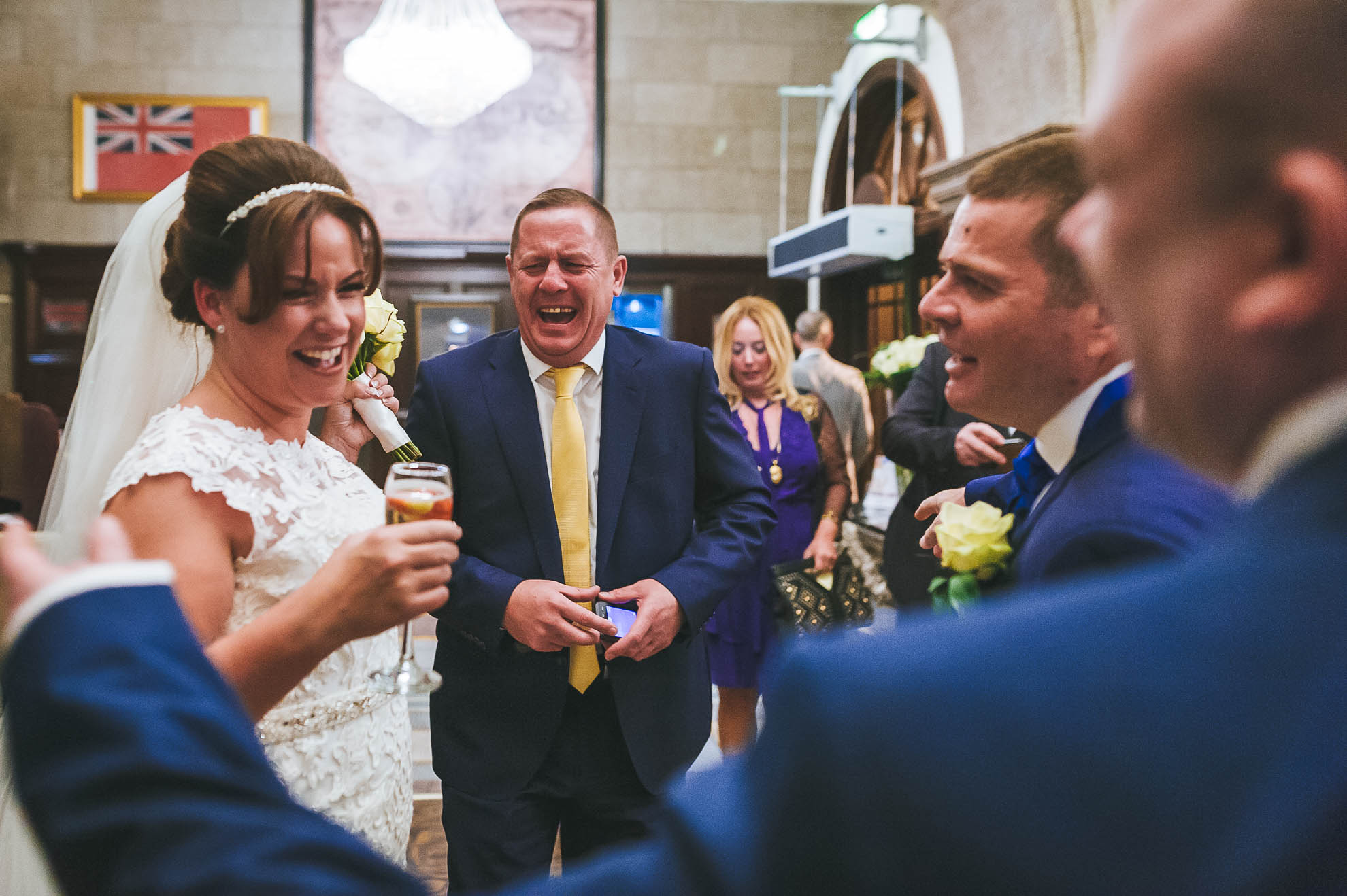 Bride shares a joke with guests
