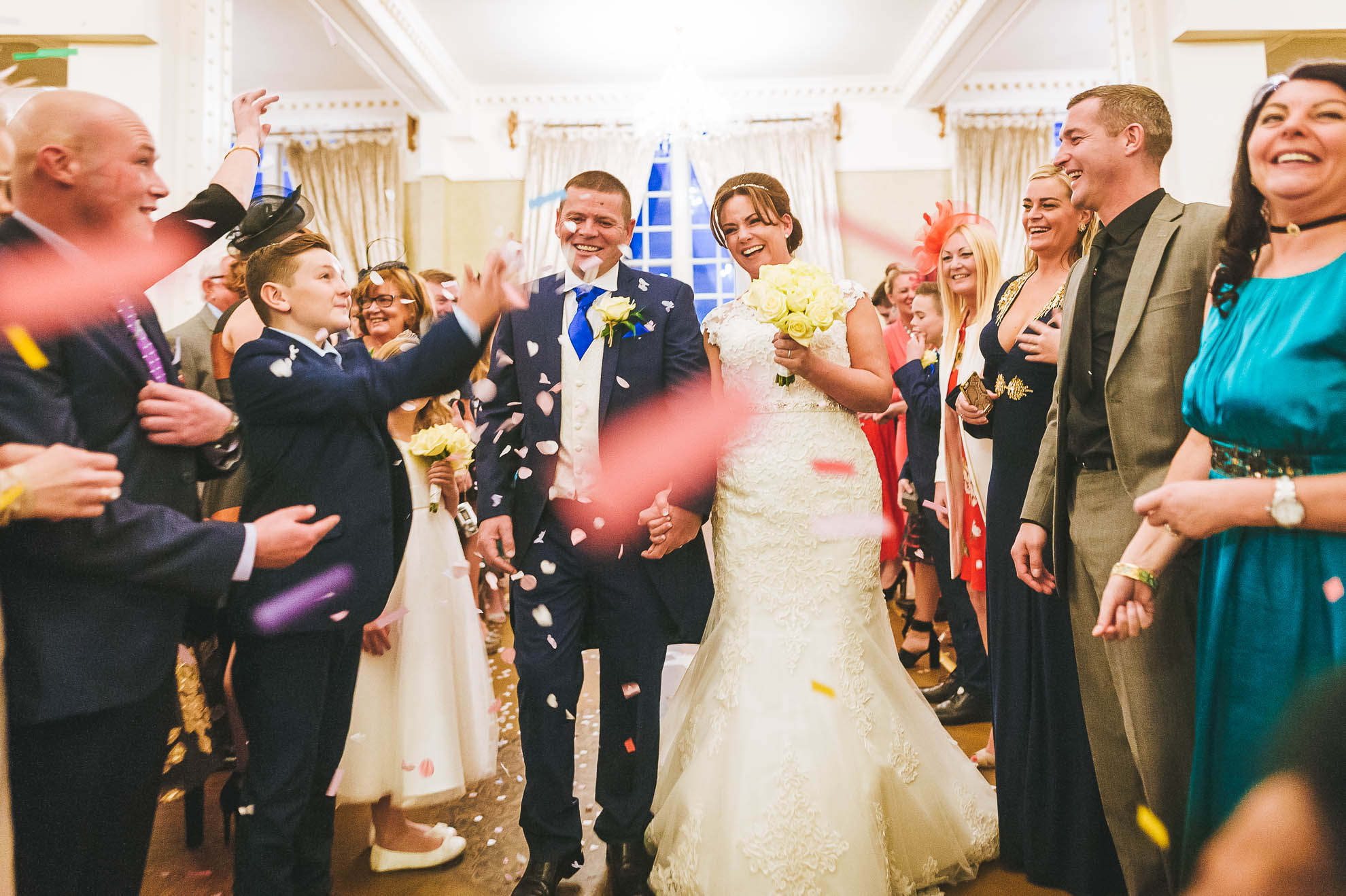 Newlyweds in confetti shower