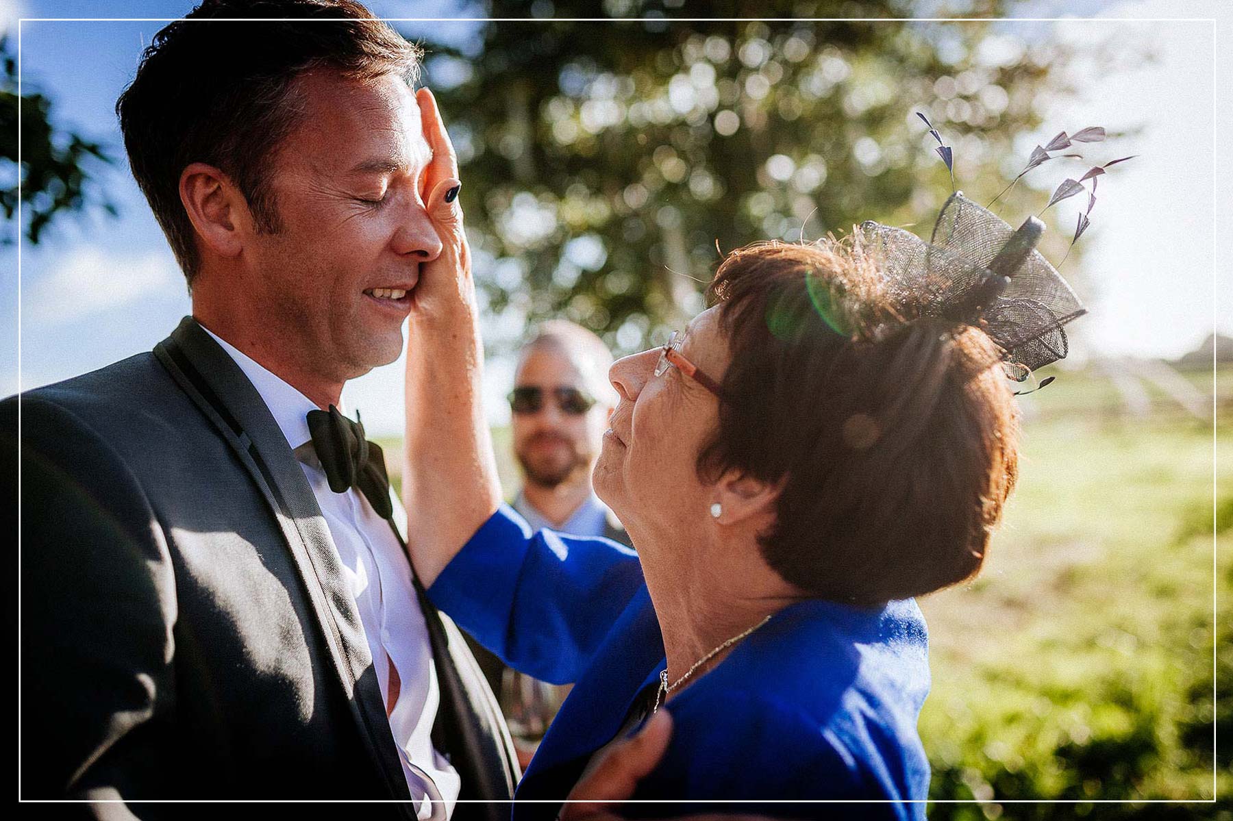 mum wiping tear from her son's eye.