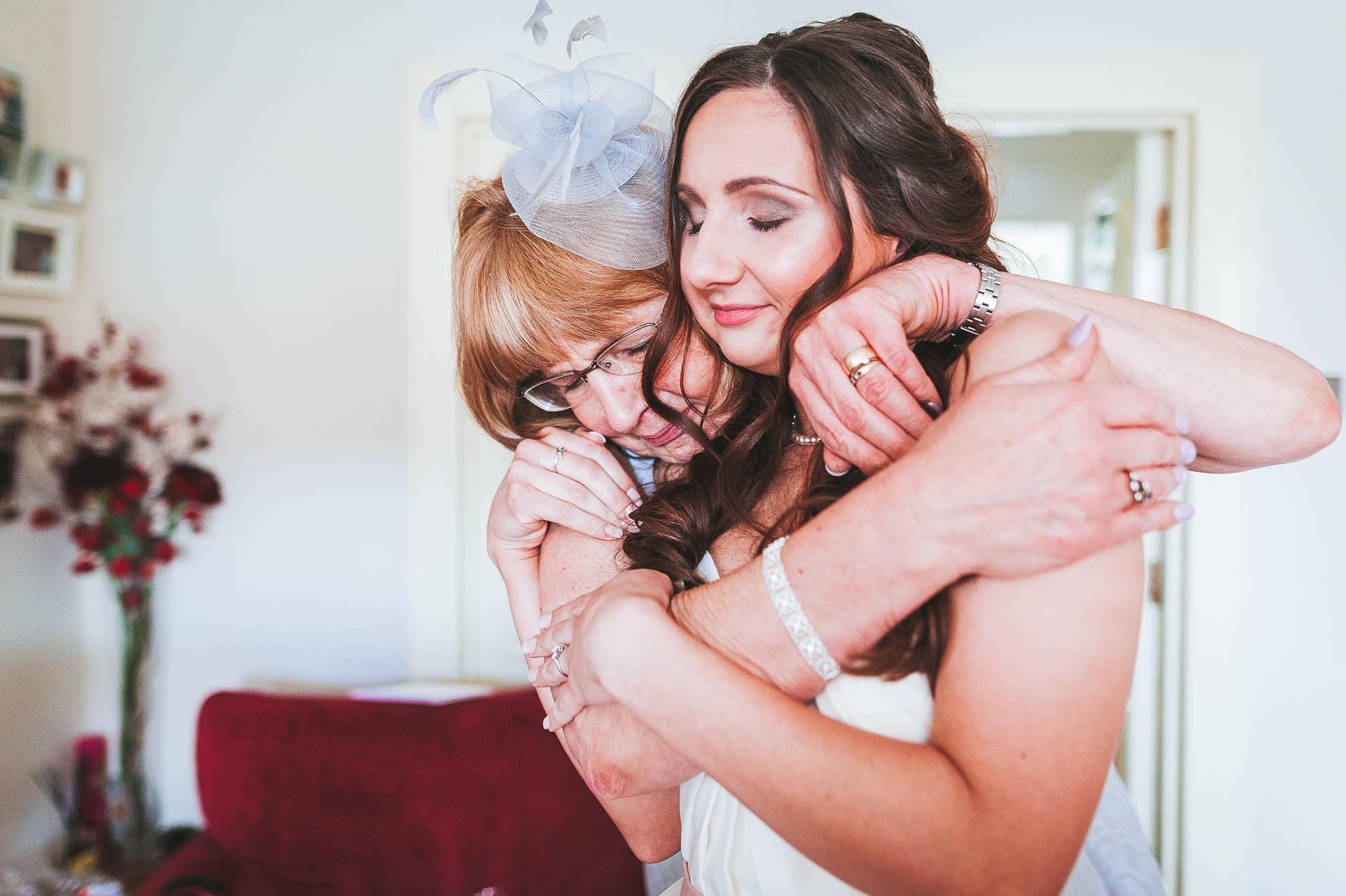 mum gives bride a hug