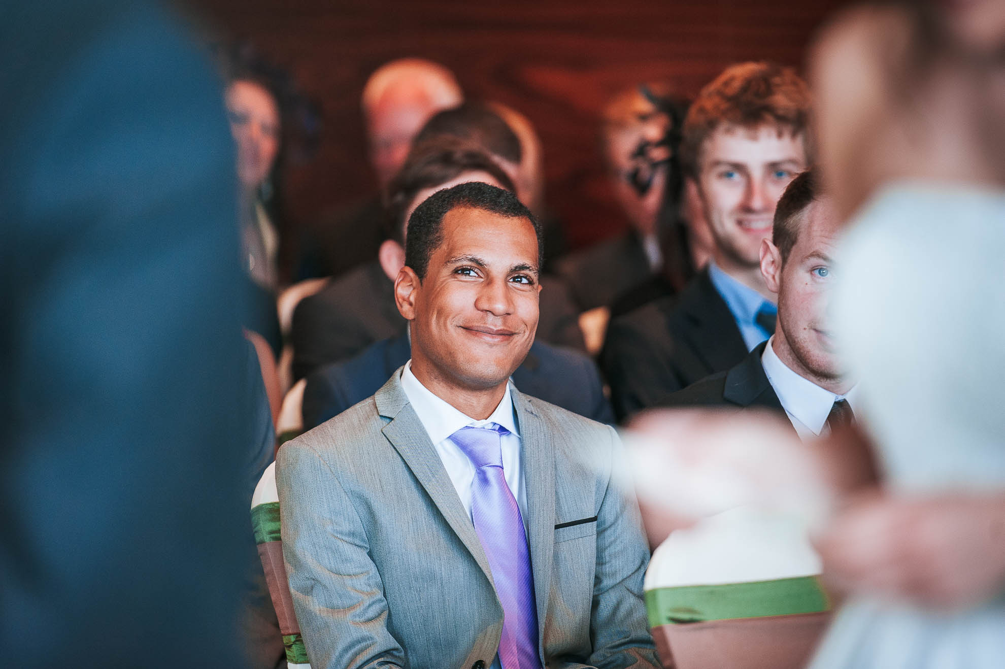 guest smiles during the wedding vows