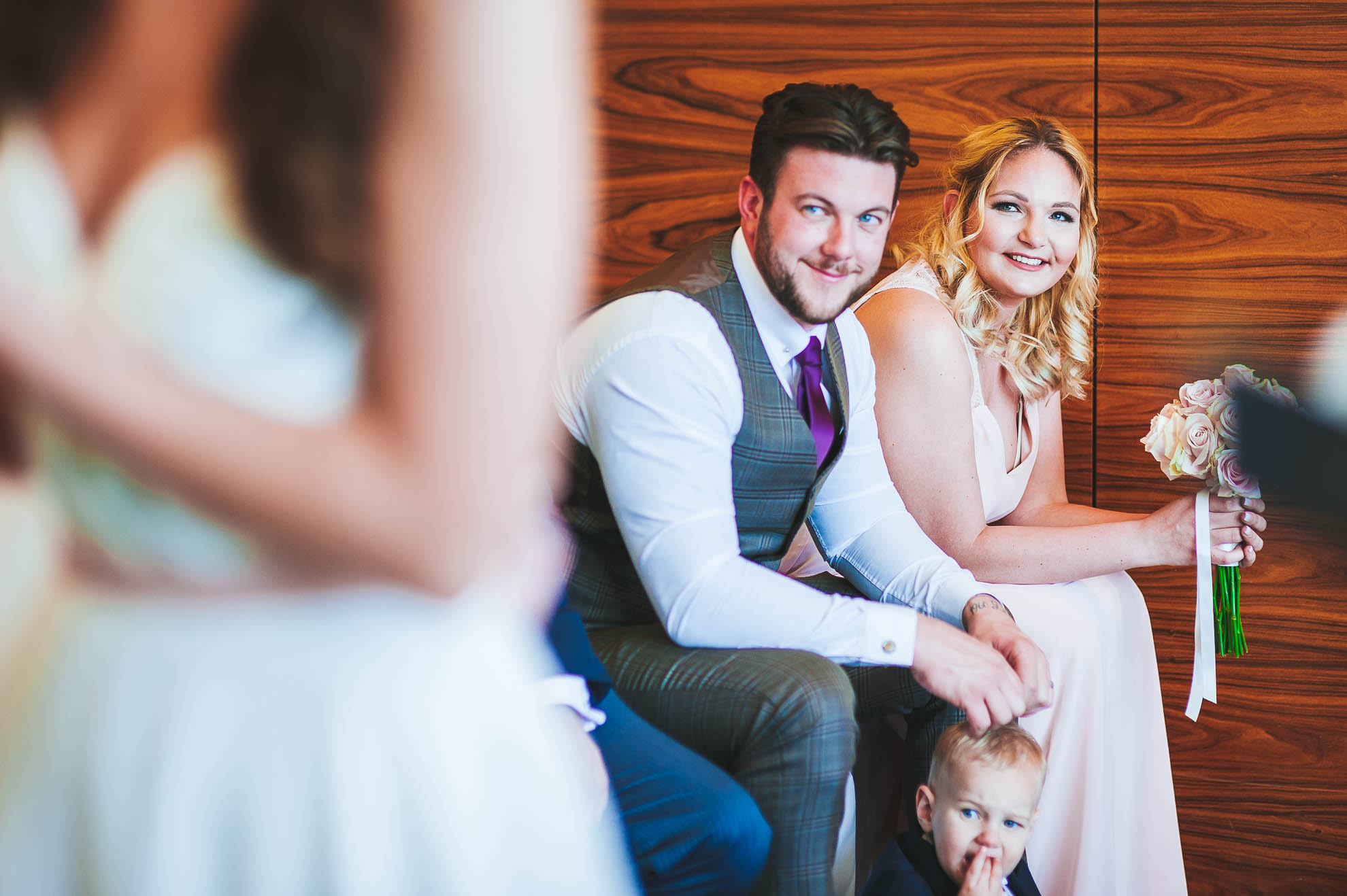 Bridesmaid looks on during the wedding ceremony