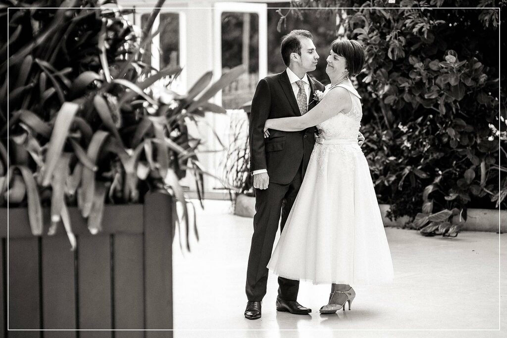 bride and groom hug each other snd smile