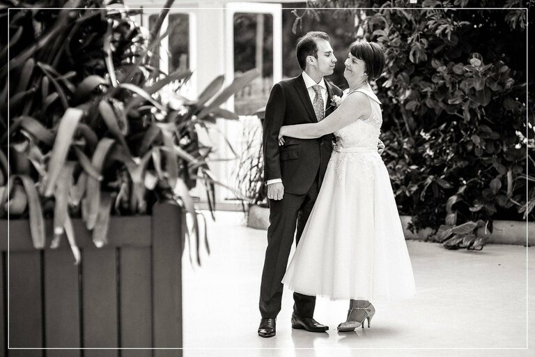 bride and groom hug each other snd smile