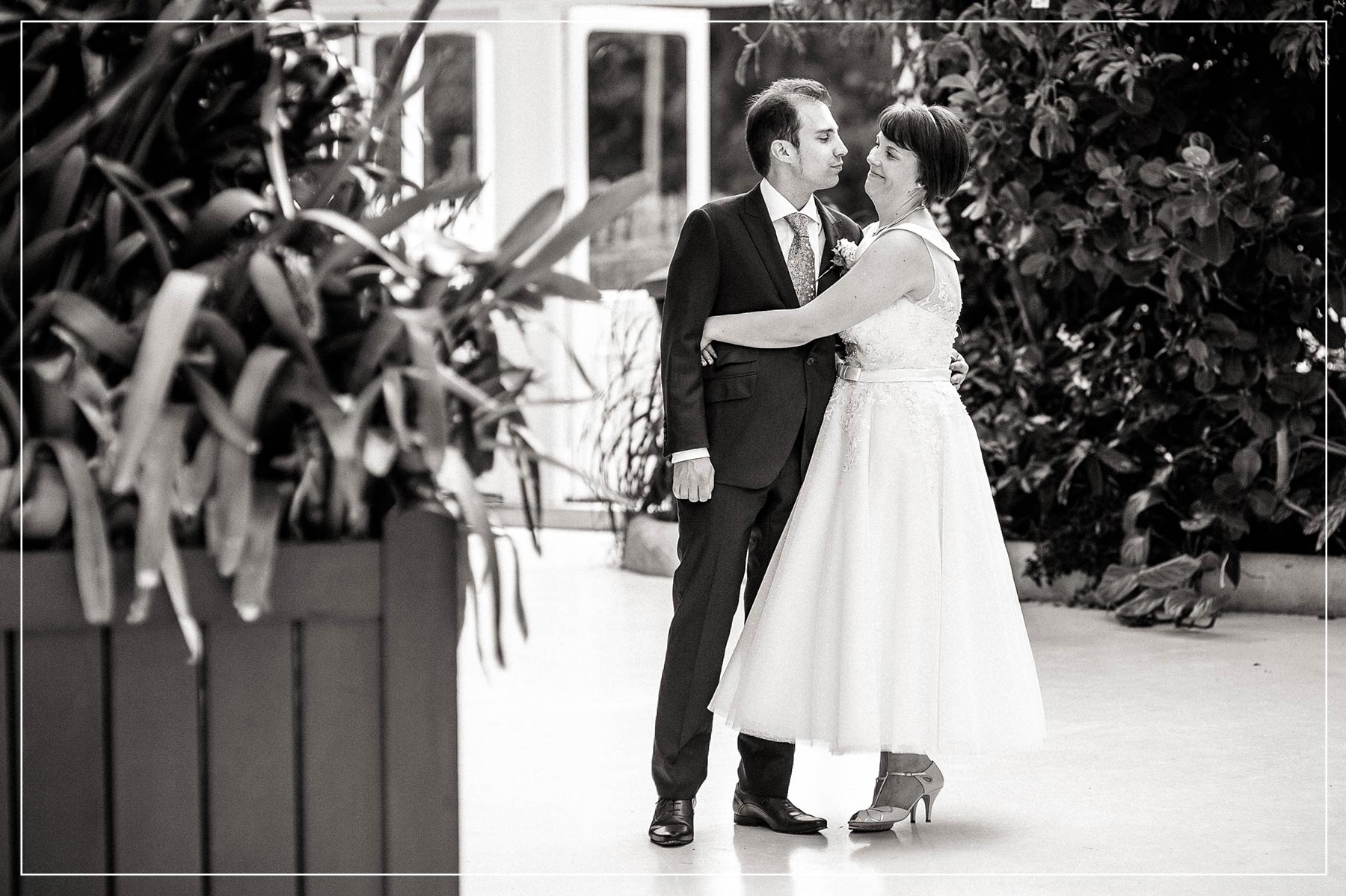 bride and groom hug each other snd smile