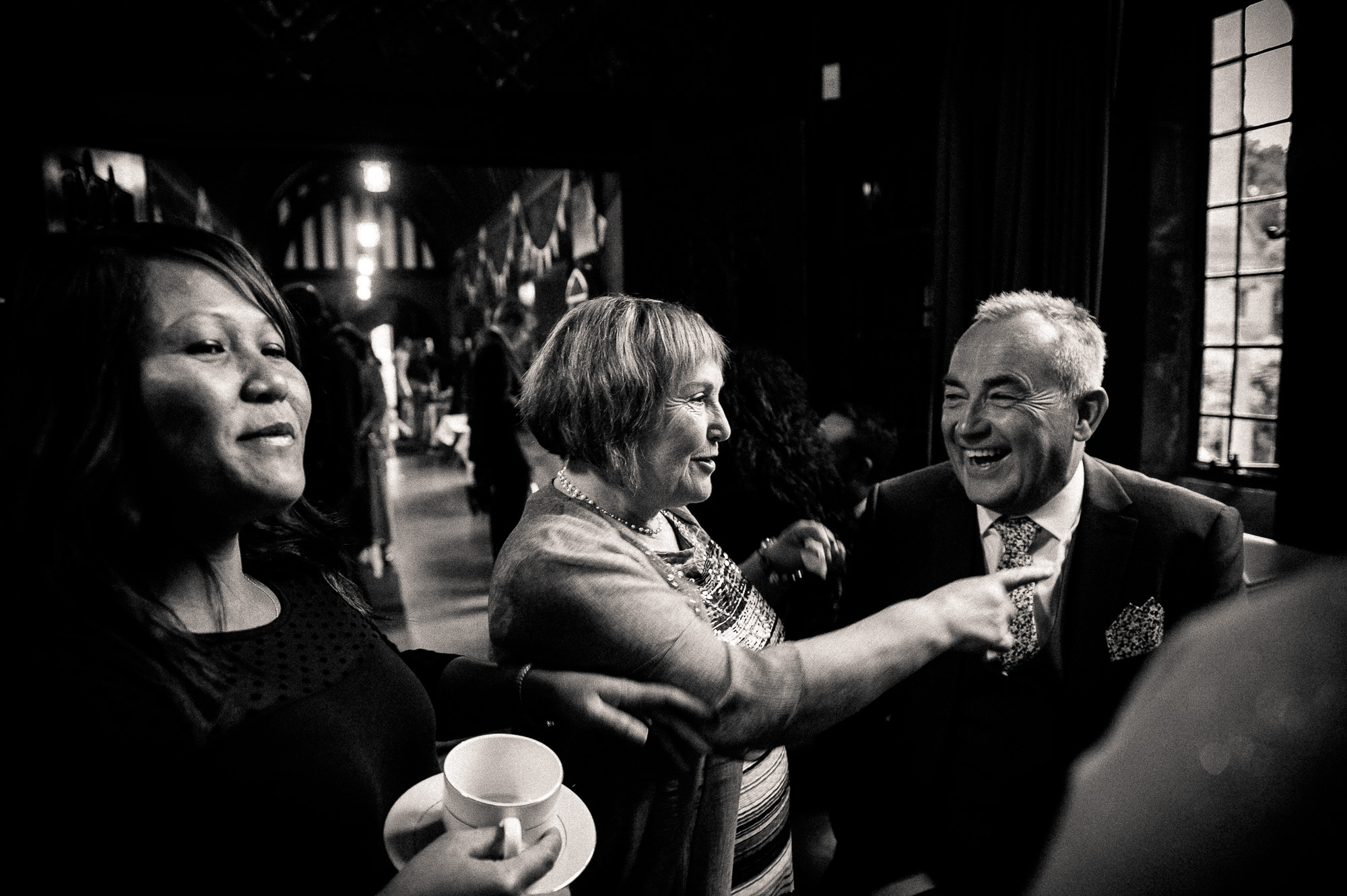 Guests share a joke during the drinks reception
