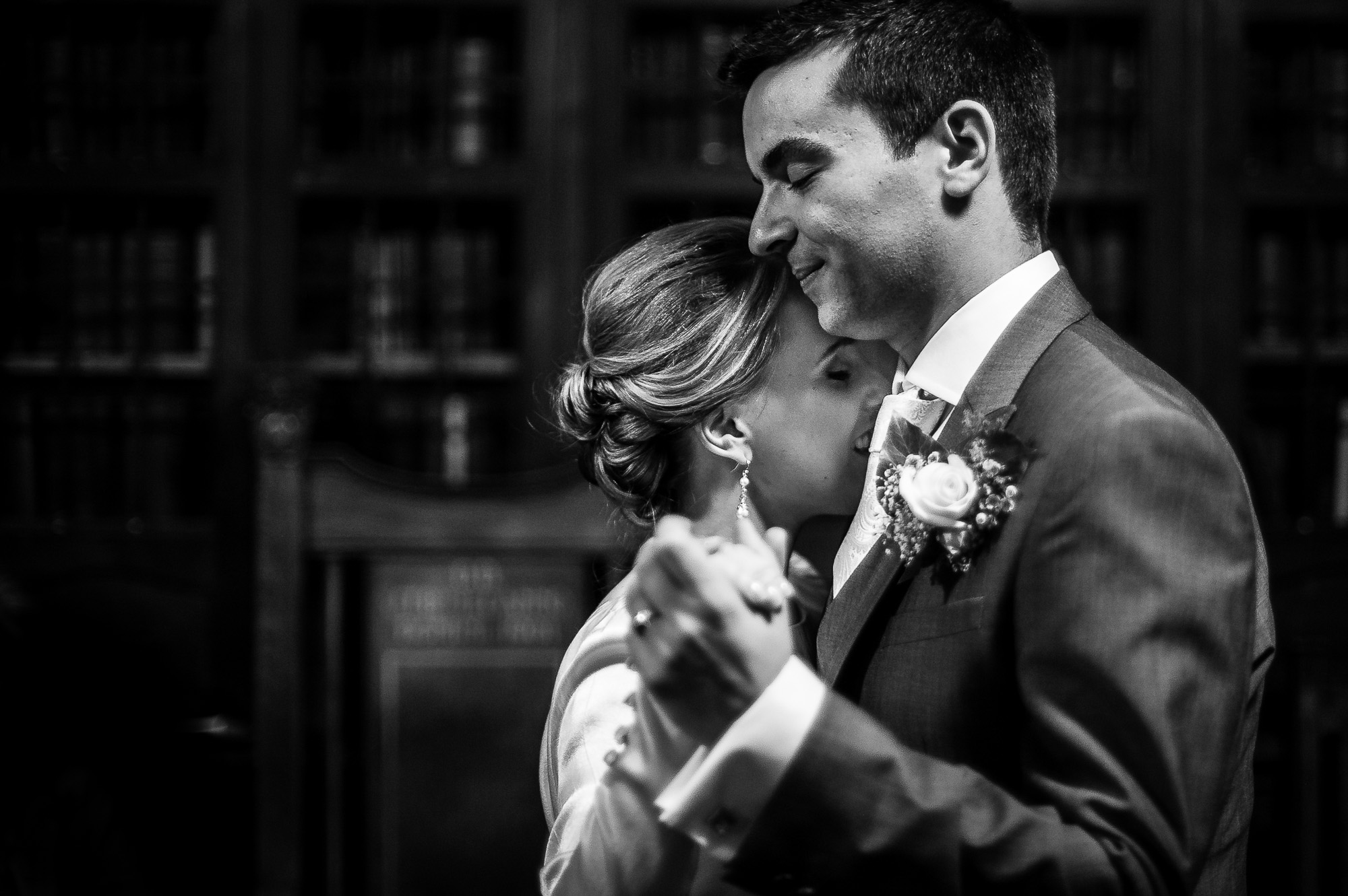 Bride and groom dancing cheek to cheek