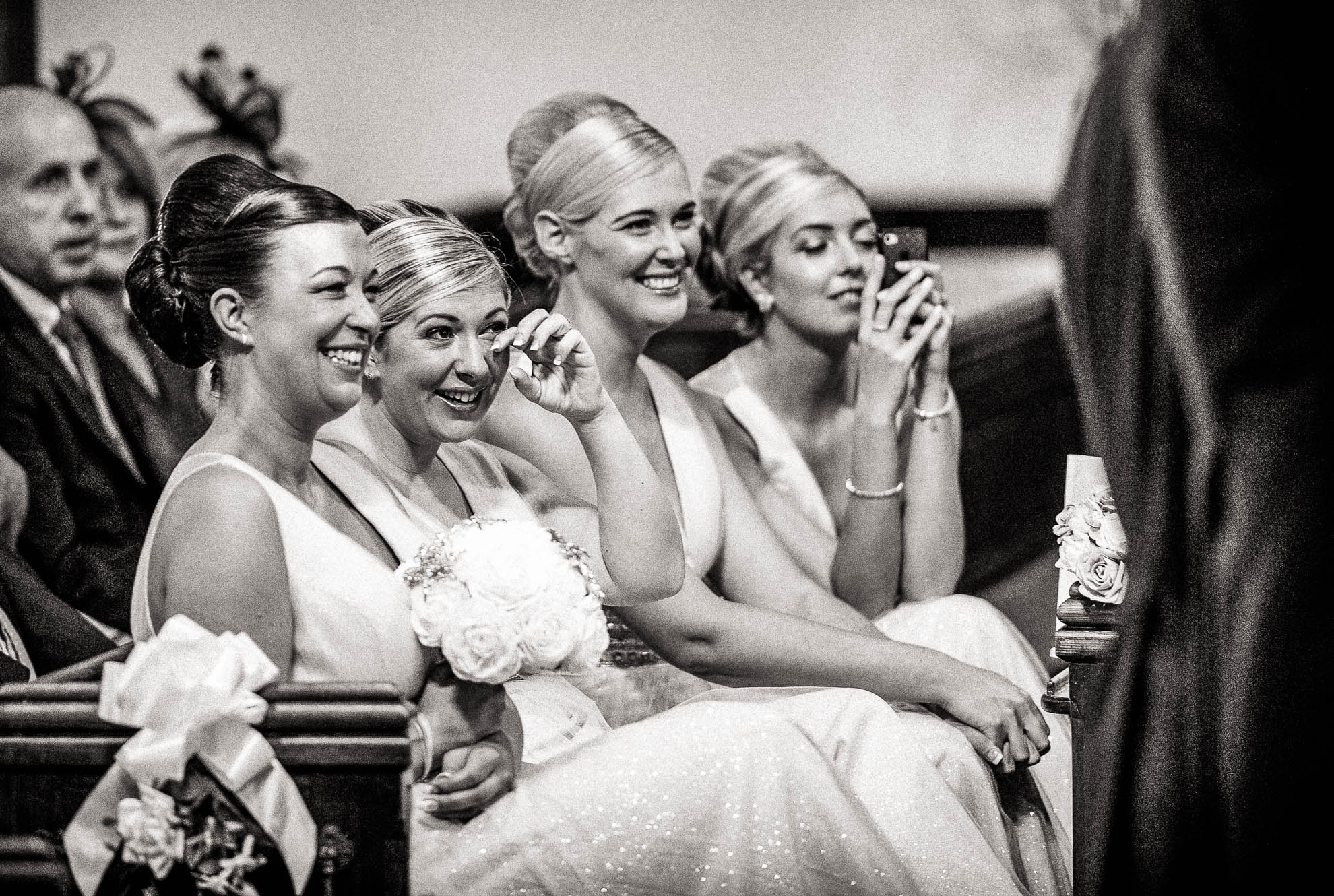 bridesmaids shed a tear during wedding vows