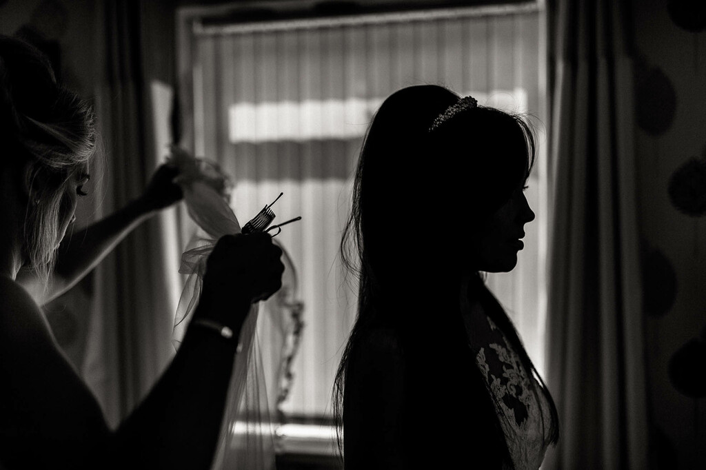 bride having her veil fitted