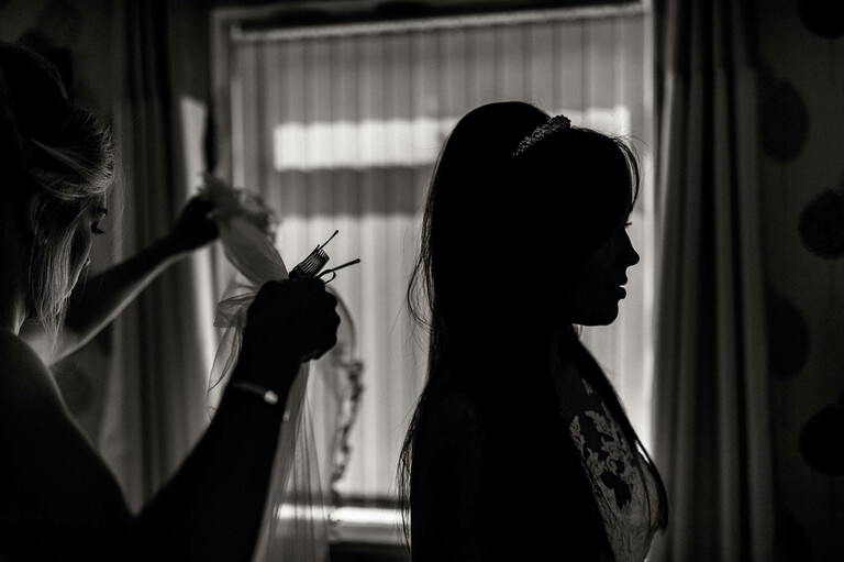 bride having her veil fitted
