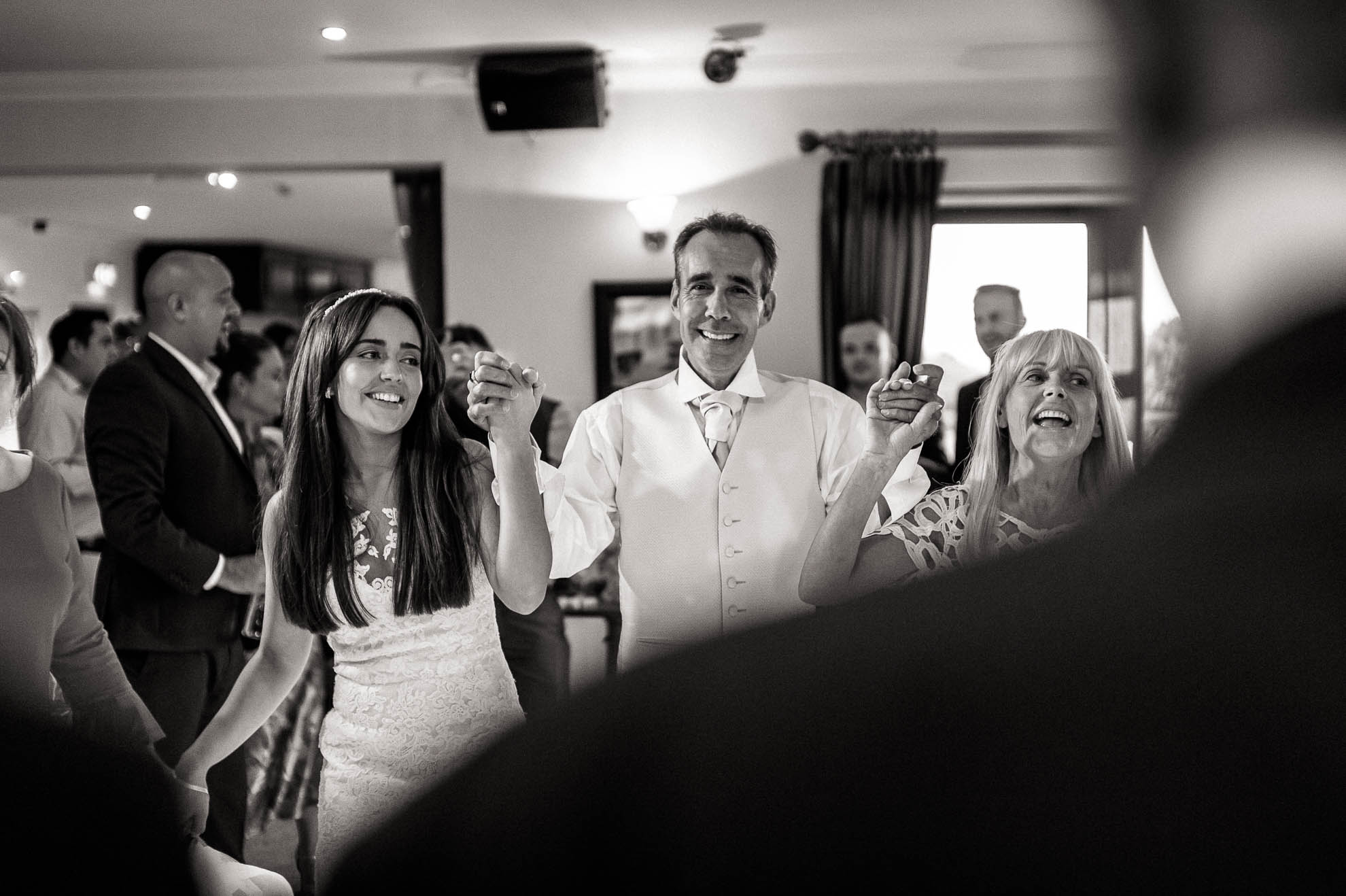 The bride dances hand in hand with her father