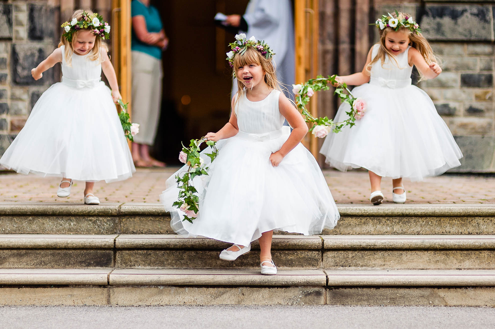 Flower girls play outside church