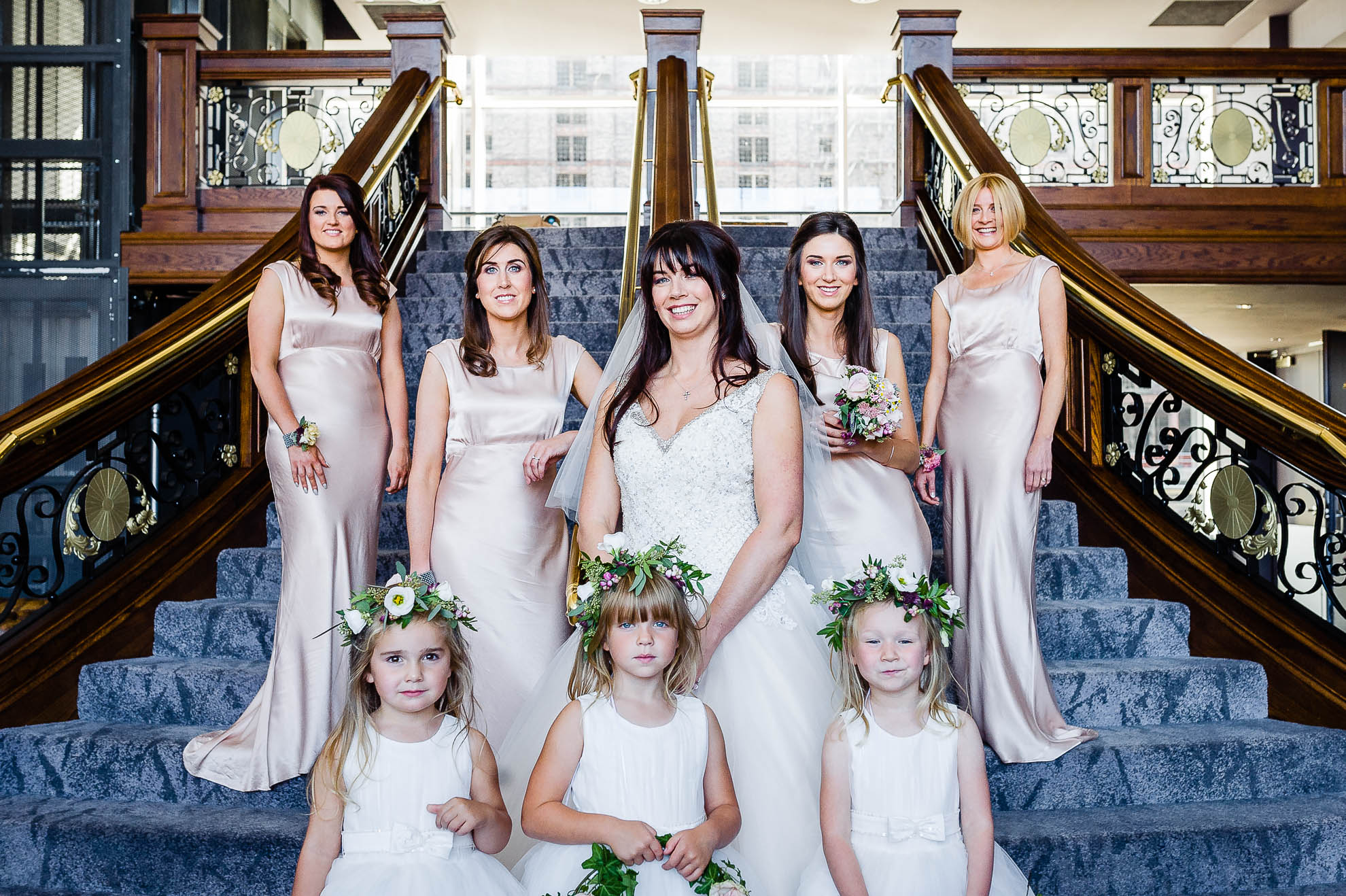 bride and her bridesmaids group photograph on titanic staircase