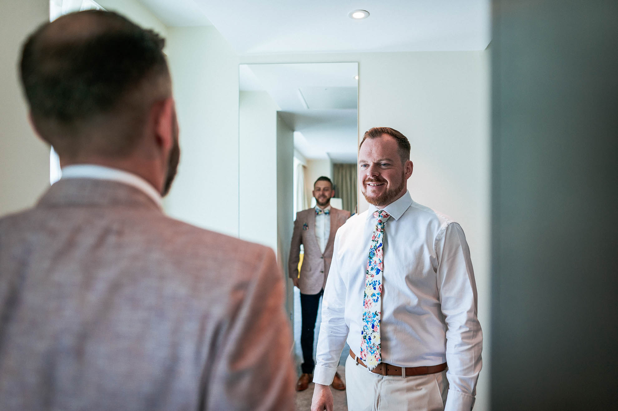 mike admires Luke's wedding suit