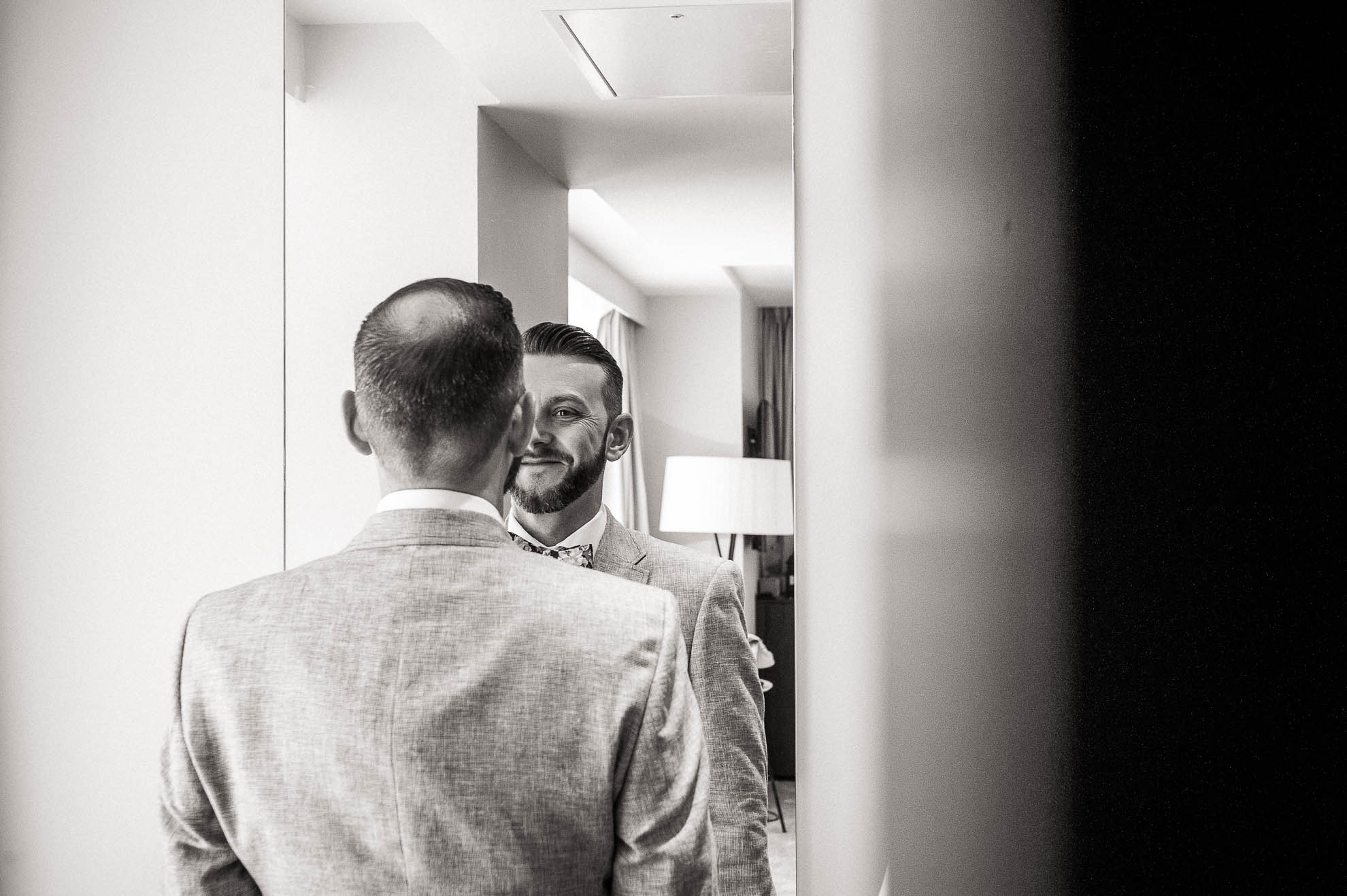 Luke smiles in the mirror