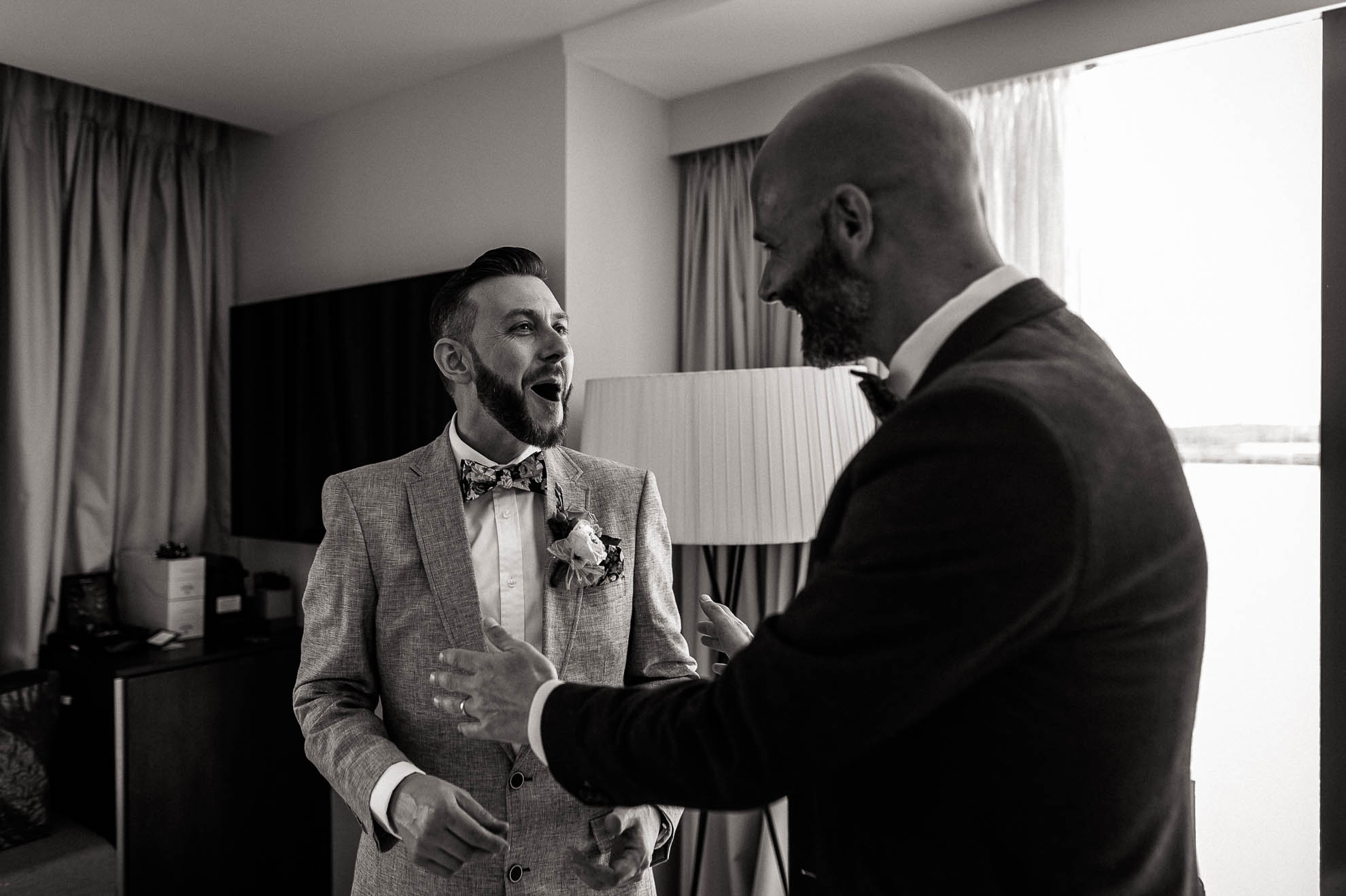 luke and a wedding guest share a joke