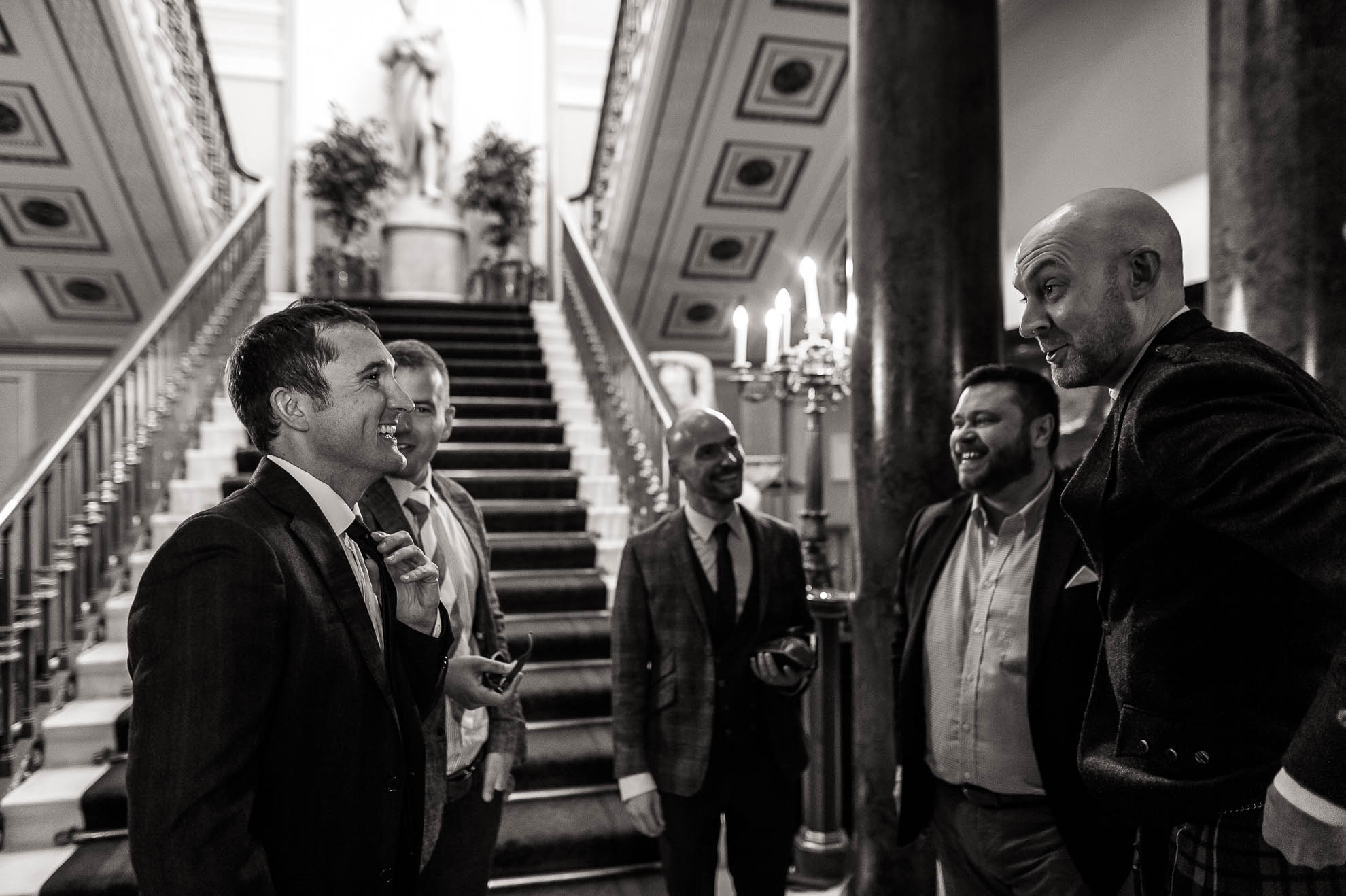 wedding guests share a joke