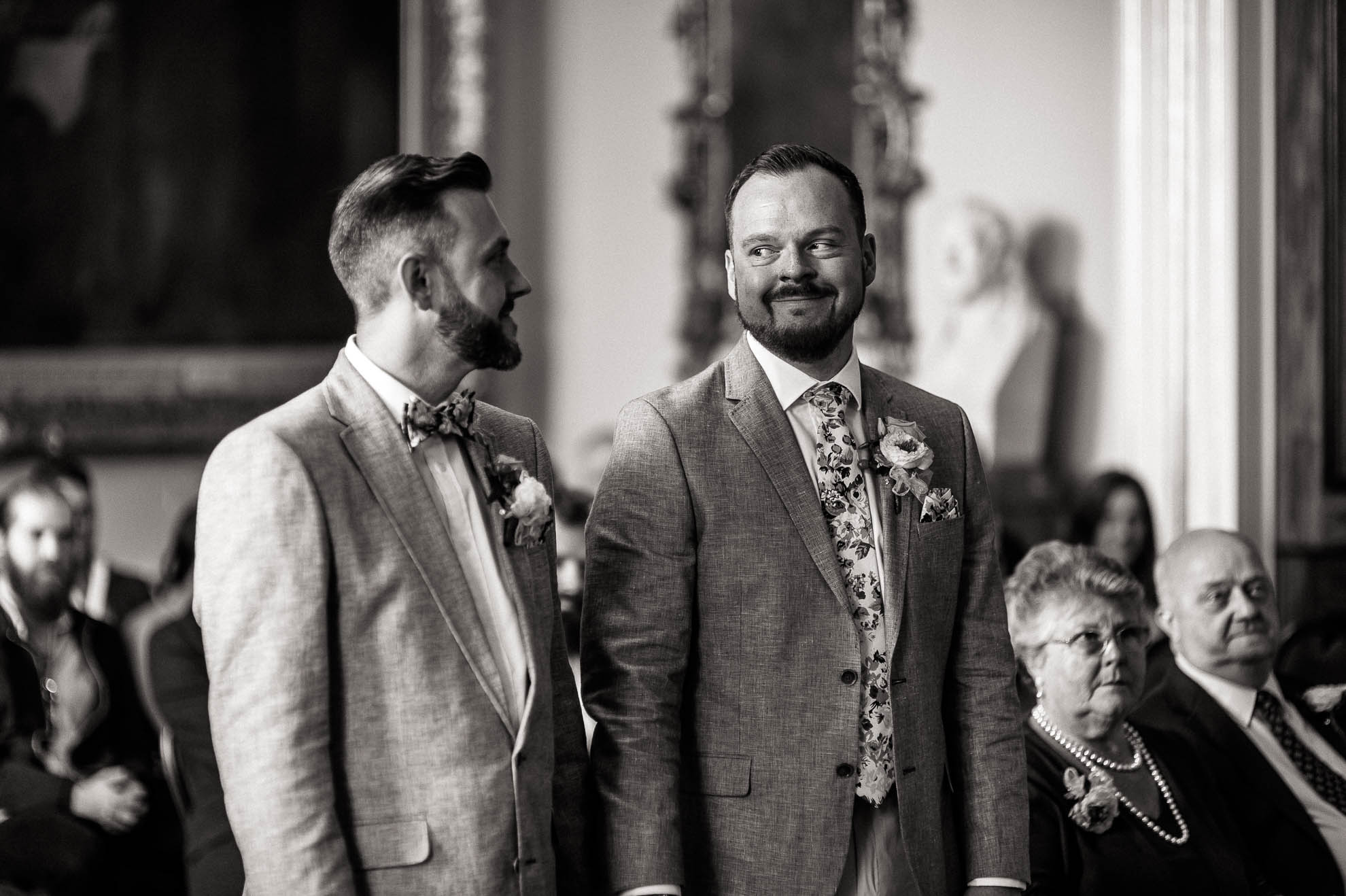 mike smiles at luke as they are married
