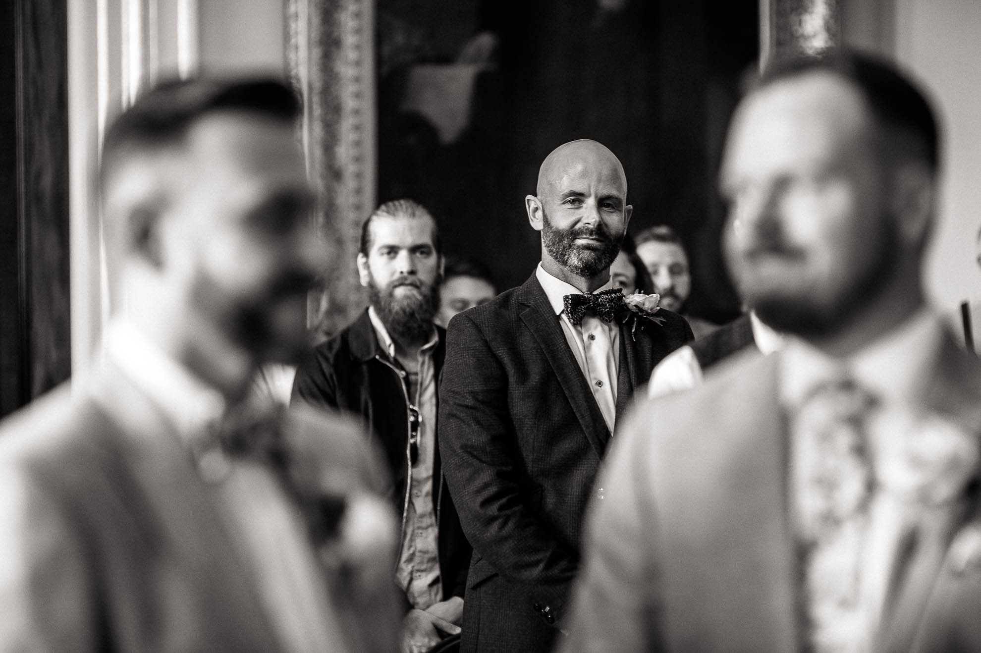 a guest looks on as the happy couple are married