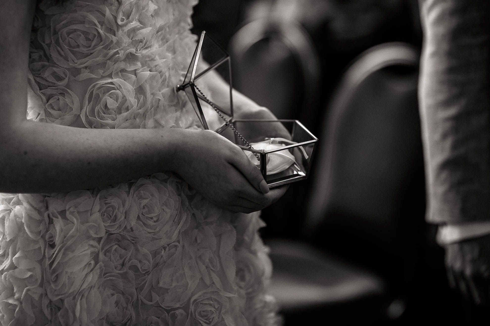 flower girl holds the wedding rings