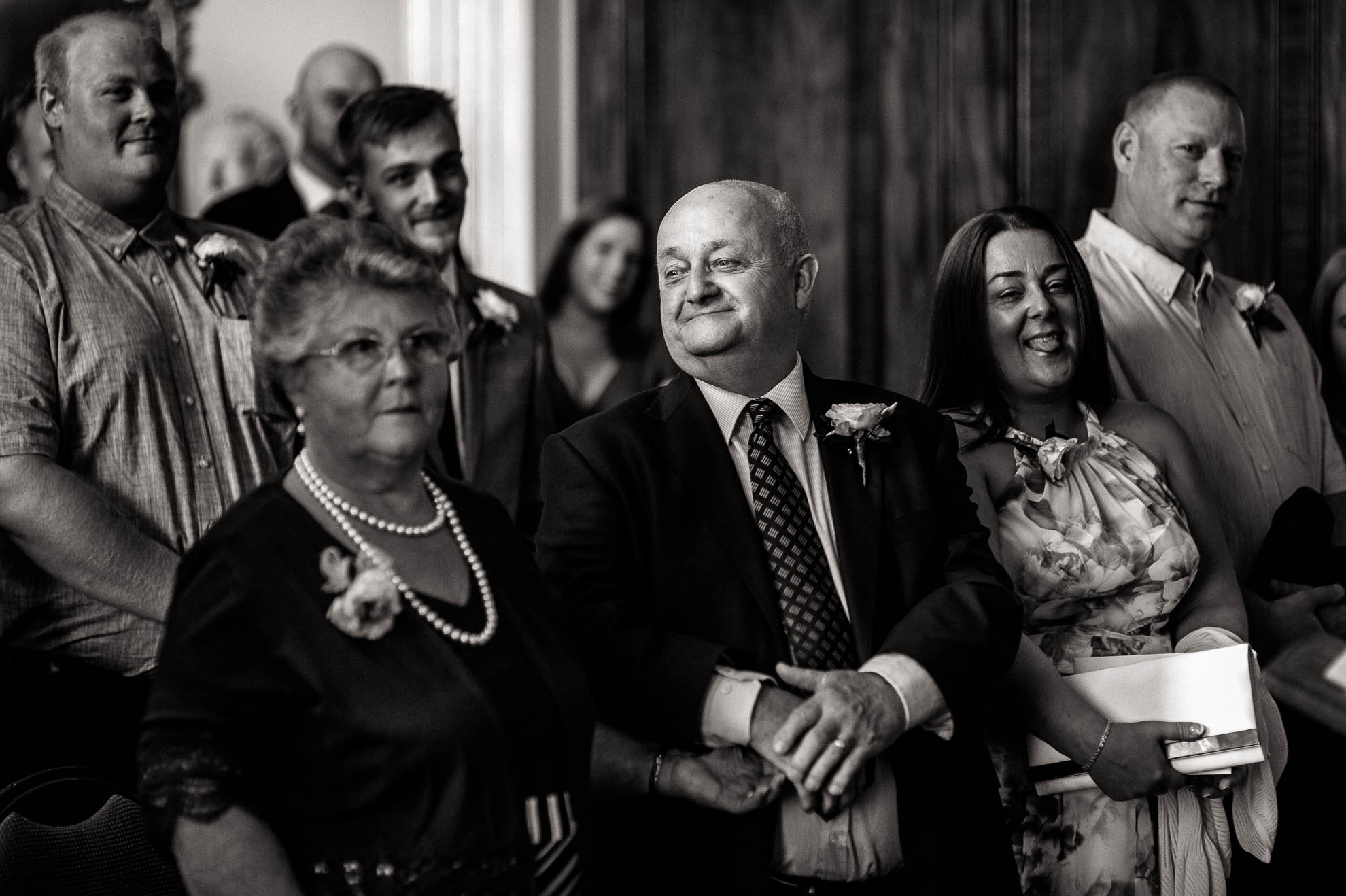 luke's mum and dad look on
