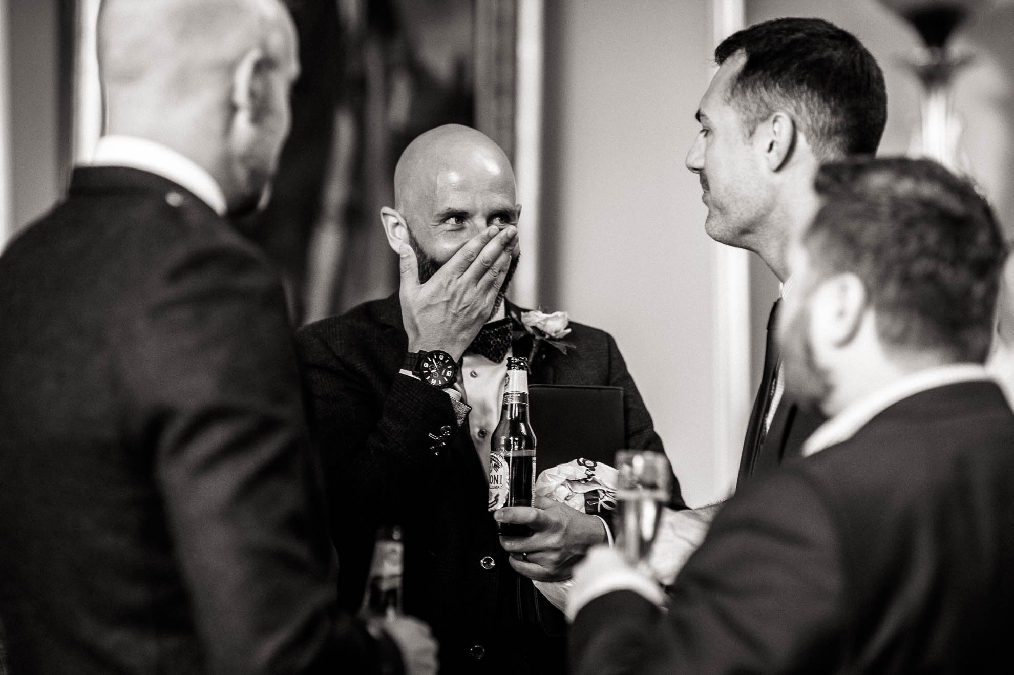 a guest laughs at a joke