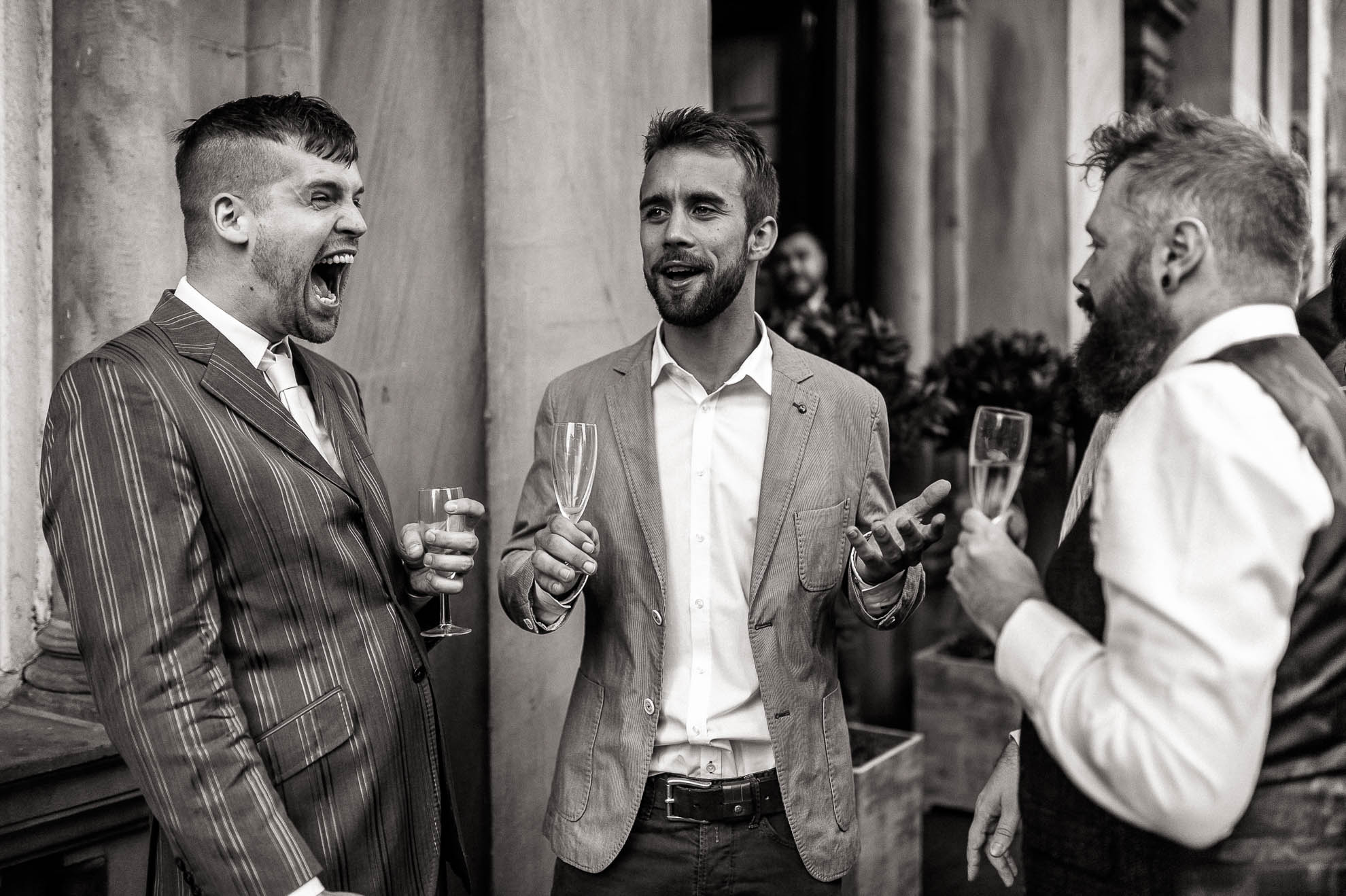 a guest laughs loudly at a joke
