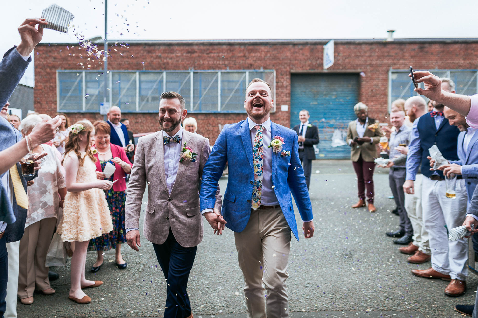 luke & mike wal through the streams of confetti
