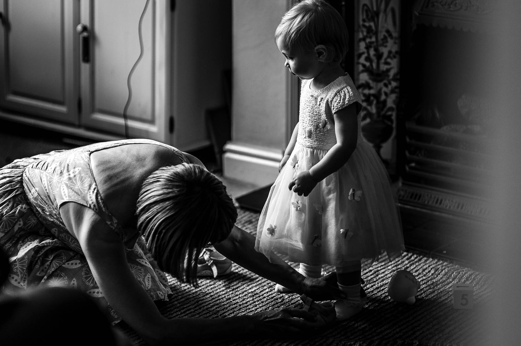 Grandmother dresses little girl