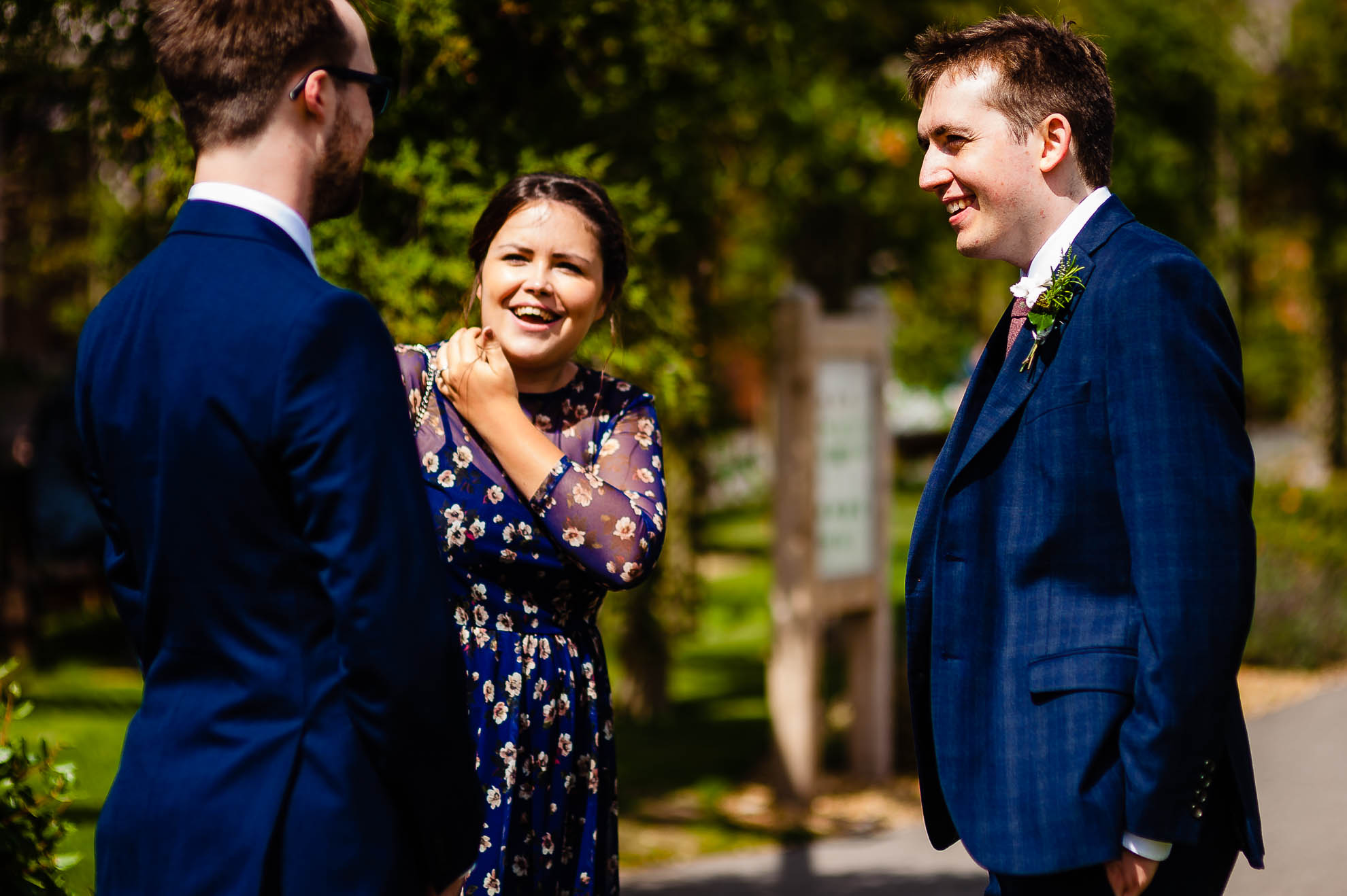 Groom greets guests at the church