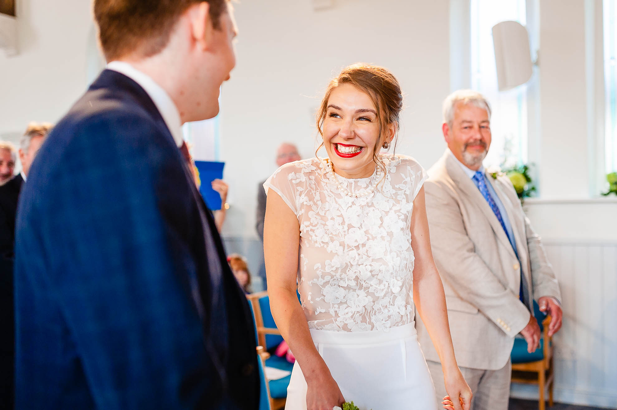 Bride gives groom a big smile