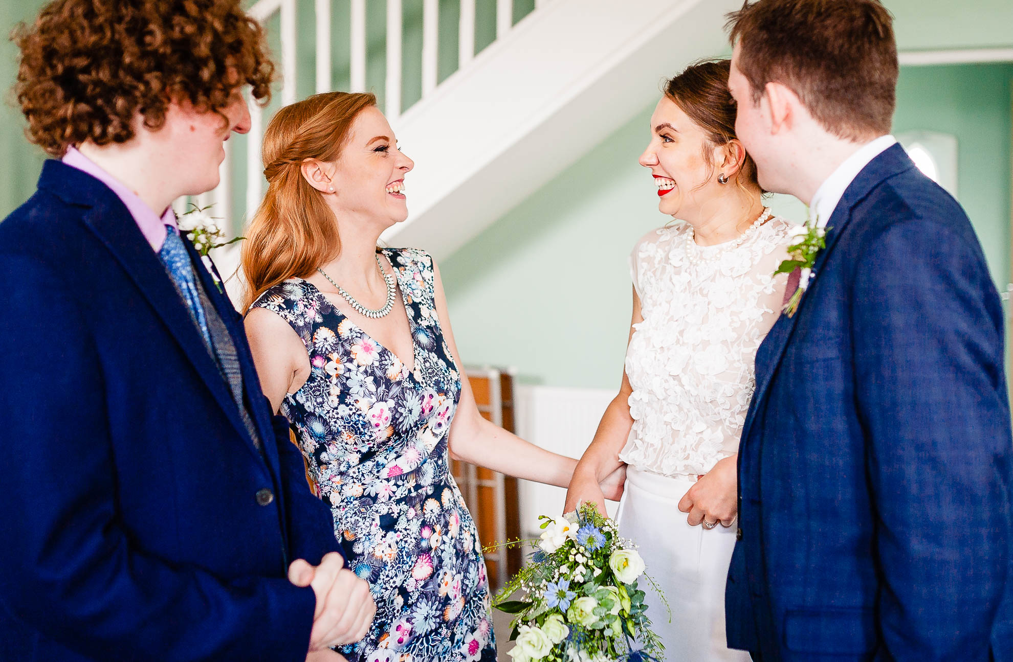 Bride and witness share a joke