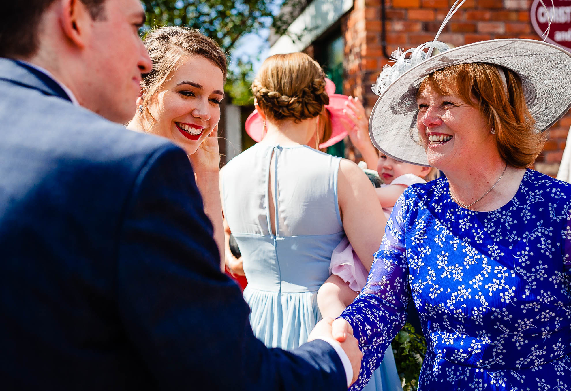 Grooms mother congratulates groom 