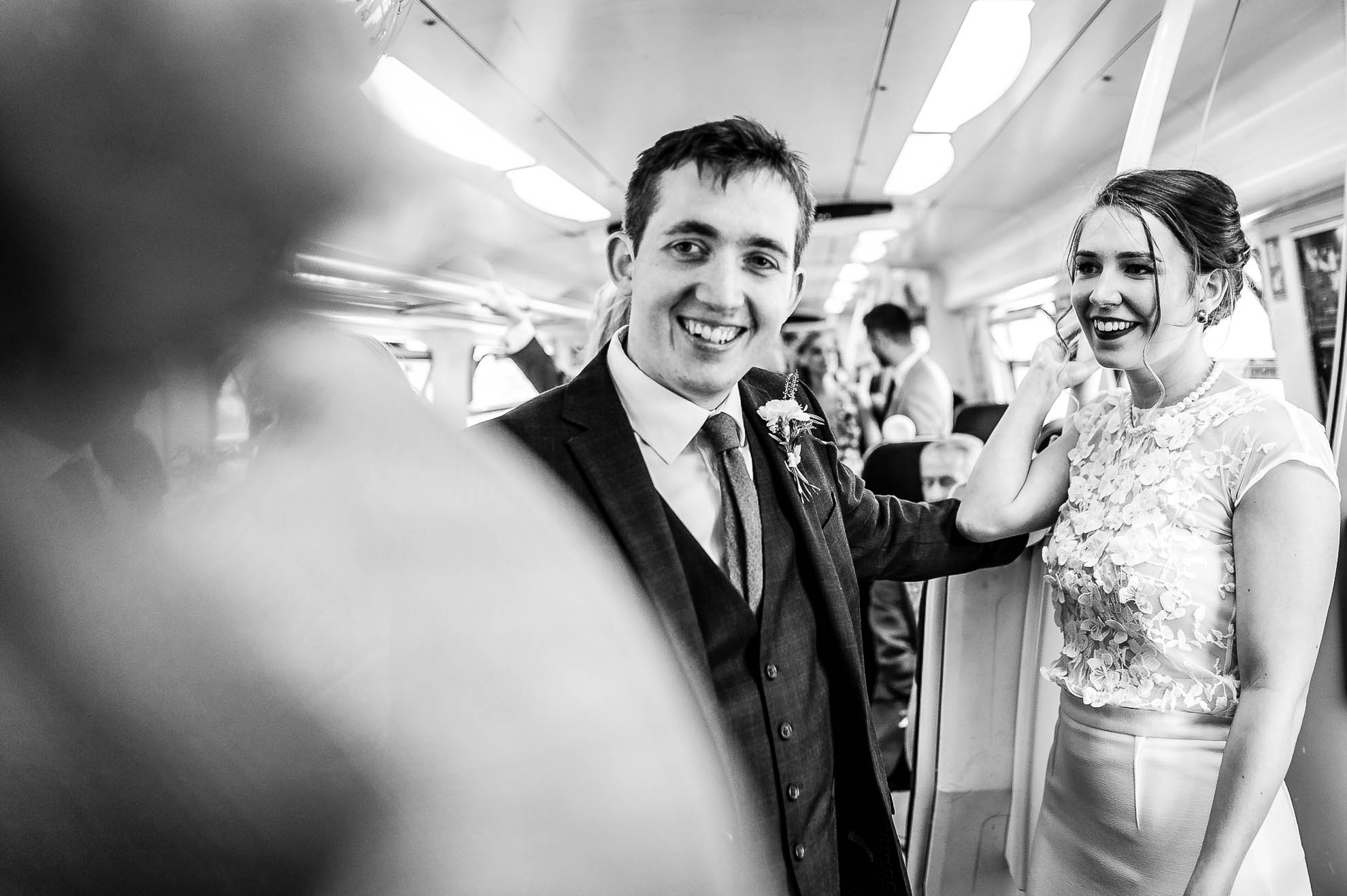 Bride and groom ride on train