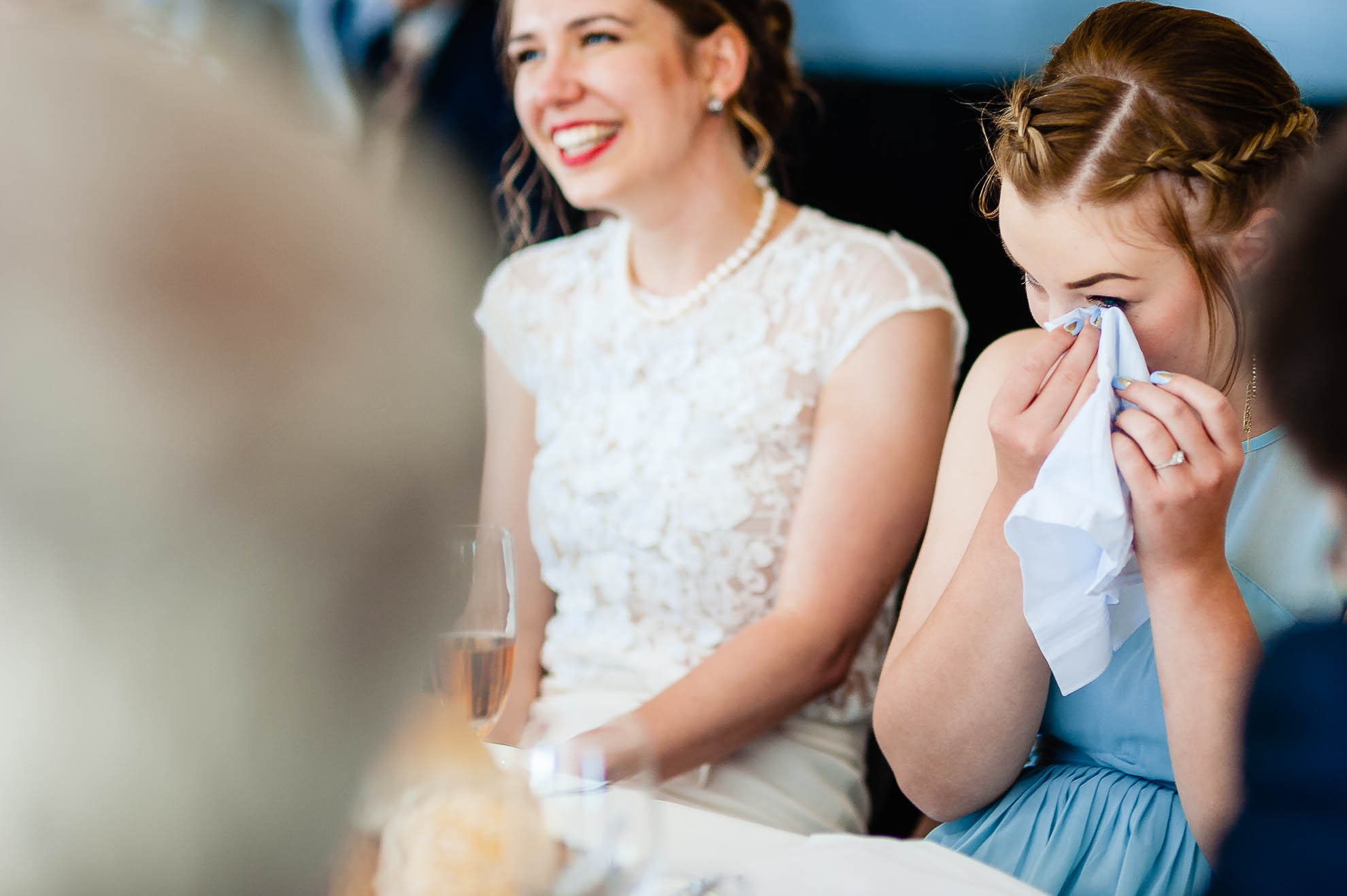Bridesmaids wipes away a tear