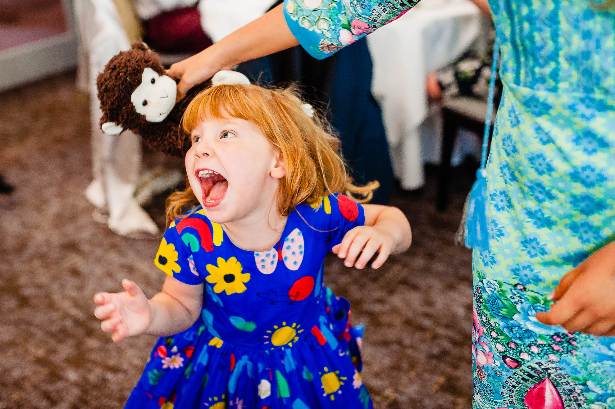 little girl playing with her mum
